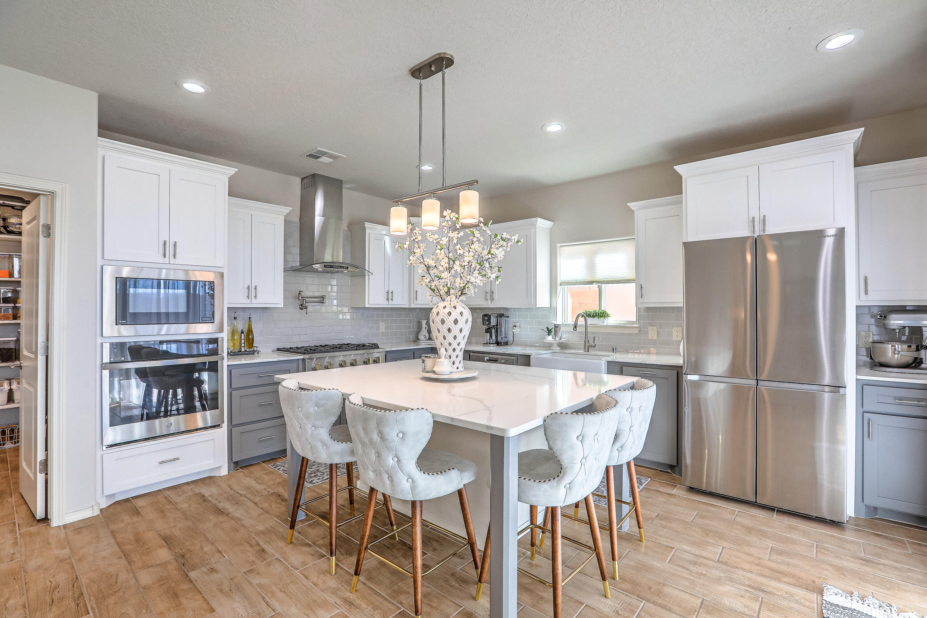 Luxurious Stillbrooke in gated Sevano Pl. is one not to miss. No expense was spared w/upgrades galore adding a modern flare throughout on a premium corner lot. The versatile floor plan offers space perfect for multi-gen living w/downstairs ensuite w/full guest bath, plus additional bedroom or home office. Chef's dream kitchen is delightful - a pantry to envy, quartz countertops, over sized island perfect for baking & entertaining, GE Monogram 6 burner gas cooktop w/pot filler for modern convenience & a ceramic apron sink for those large pots. Continue upstairs to amble loft w/views, upper laundry, two more bedrooms and a gorgeous owner suite w/view deck & spa-like bath. I25, access, close to restaurants, stores & Domingo Baca Park/Community Ctr., location couldn't be better.