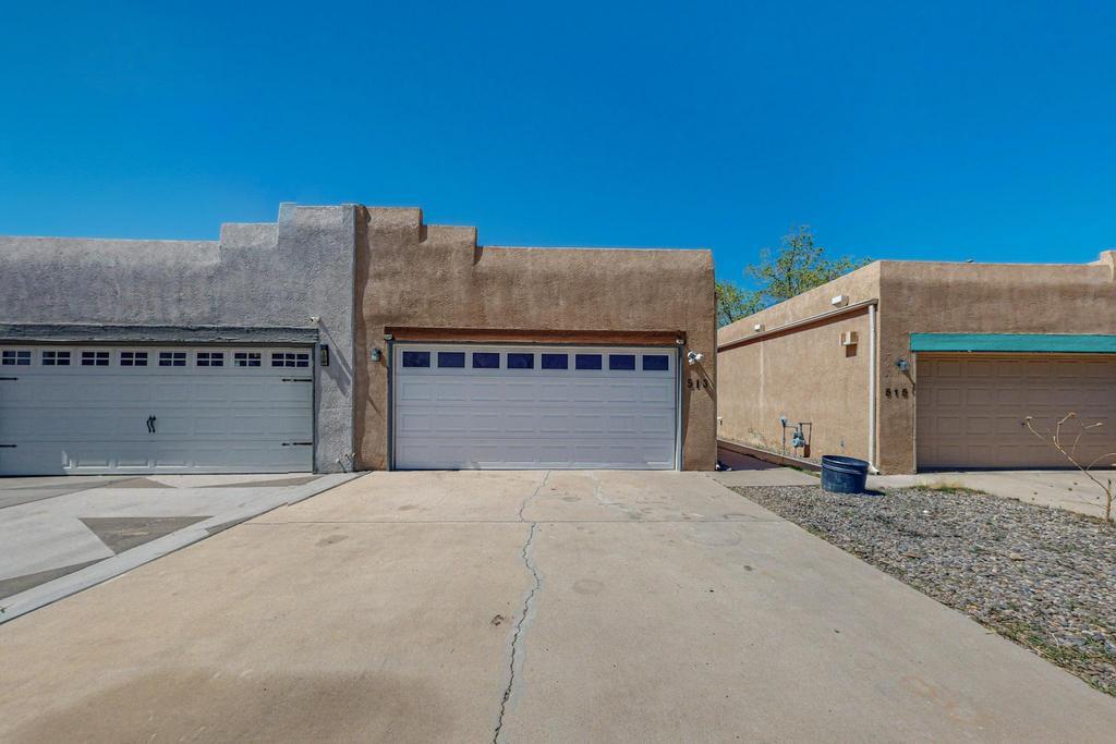 NEW Price! Let striking beams and a gas fireplace welcome you to this southwest designed townhouse. Stay cool this summer with refrigerated air installed 2023 and paid for SOLAR!  Has Tpo roof, new water heater 2024. Finished 2 car garage with shelving. With sustainability, efficiency, and convenience in mind, this townhouse offers easy access to shopping, Uptown, UNM, top hospitals, and easy freeway access. Plus, with the San Mateo @ Central bus station close by, commuting is a breeze.