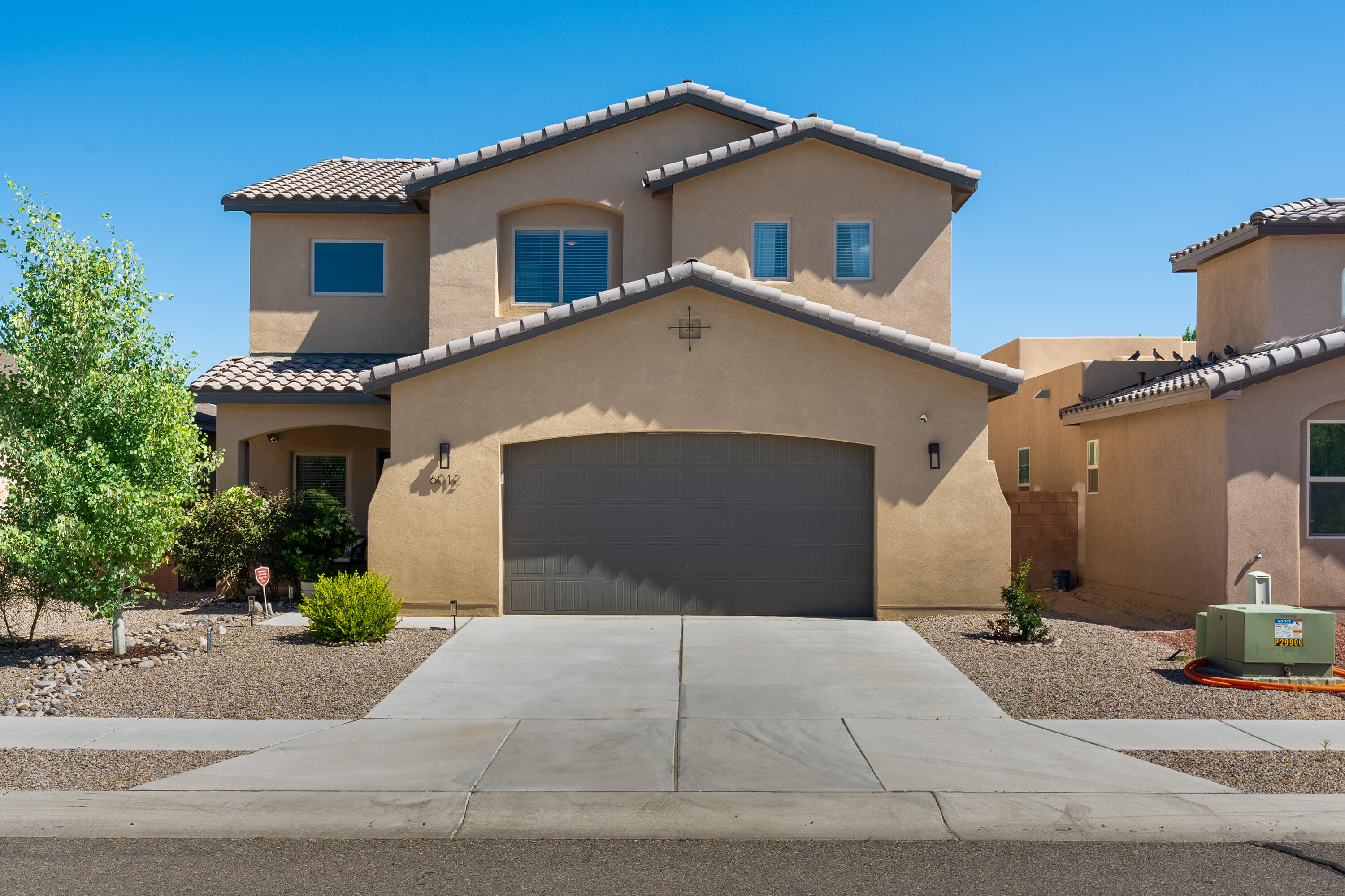 This stunning 3-bedroom home is meticulously maintained, with every detail carefully crafted to create a warm and inviting atmosphere. As you step inside, you are greeted by a spacious entry, the open floor plan featuring gorgeous kitchen with granite counter tops, the downstairs floorplan flows between the dining room into the living room, perfect for entertaining or relaxing. The cozy loft above adds an extra touch of charm, offering a serene spot to unwind or enjoy a good book. Outside, the beautifully landscaped backyard is a lush oasis of greenery, creating a peaceful retreat. This home is tucked away but close to shops, hospitals, parks.