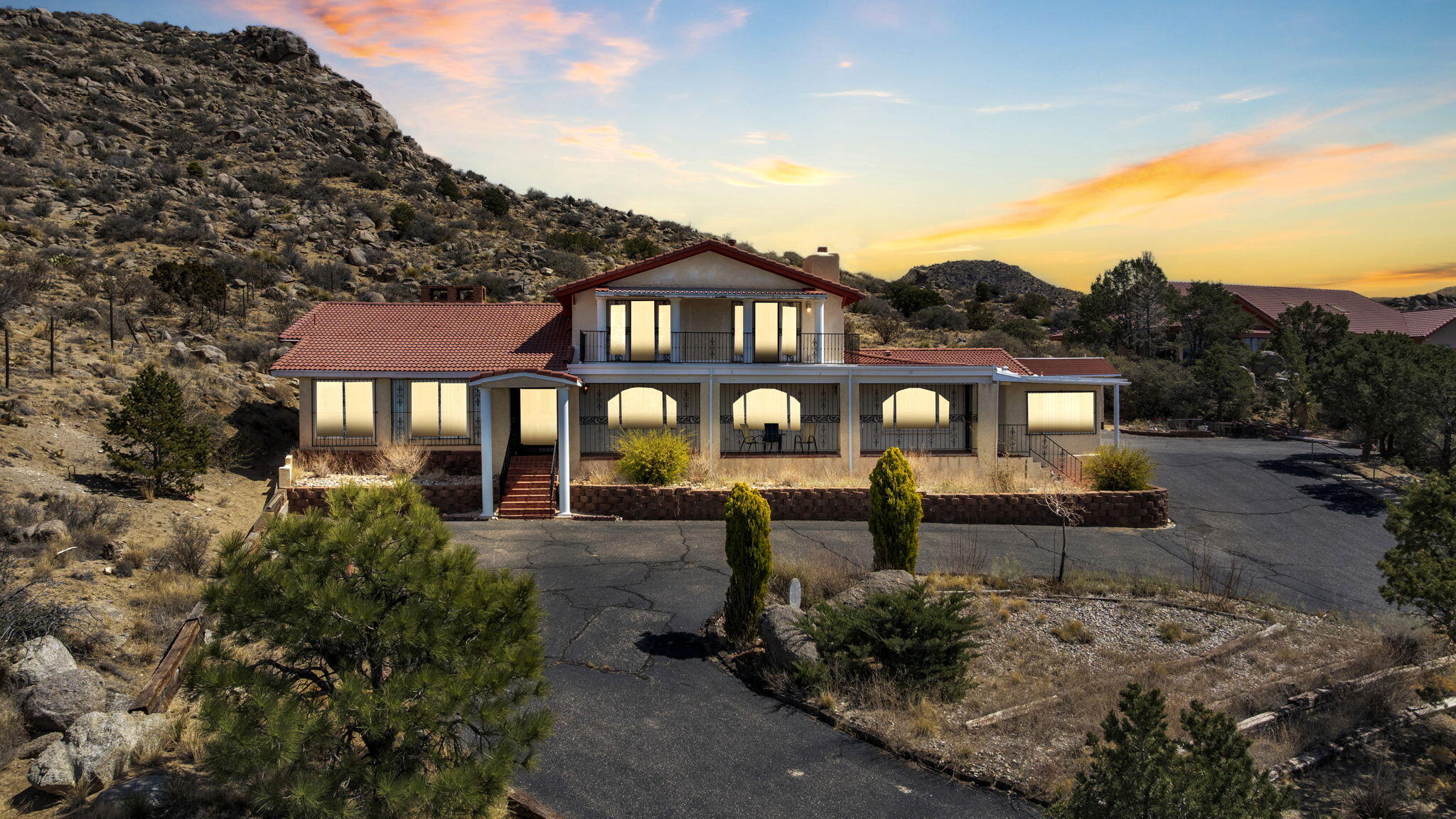 Stunning 5-bed, 4-bath hillside estate situated on over an acre in the highly desirable Four Hills neighborhood. Privately gated at the end of a quiet cul-de-sac, this exceptional home offers panoramic views, privacy, and the freedom of no HOA or restrictive covenants. The great room showcases vaulted ceilings, built-ins, and a beautiful fireplace. Marble tile flooring adds elegance to the main living and bath areas. Enjoy 2 thoughtfully designed kitchen areas one for meal preparation and one for cooking plus formal and informal dining divided by a striking two-way fireplace. The spacious primary suite includes two private en suites. Additional highlights include Jack & Jill baths, a sunroom, bonus rooms, balconies, and a 2 car garage with workroom and storage. Tour this rare market find!