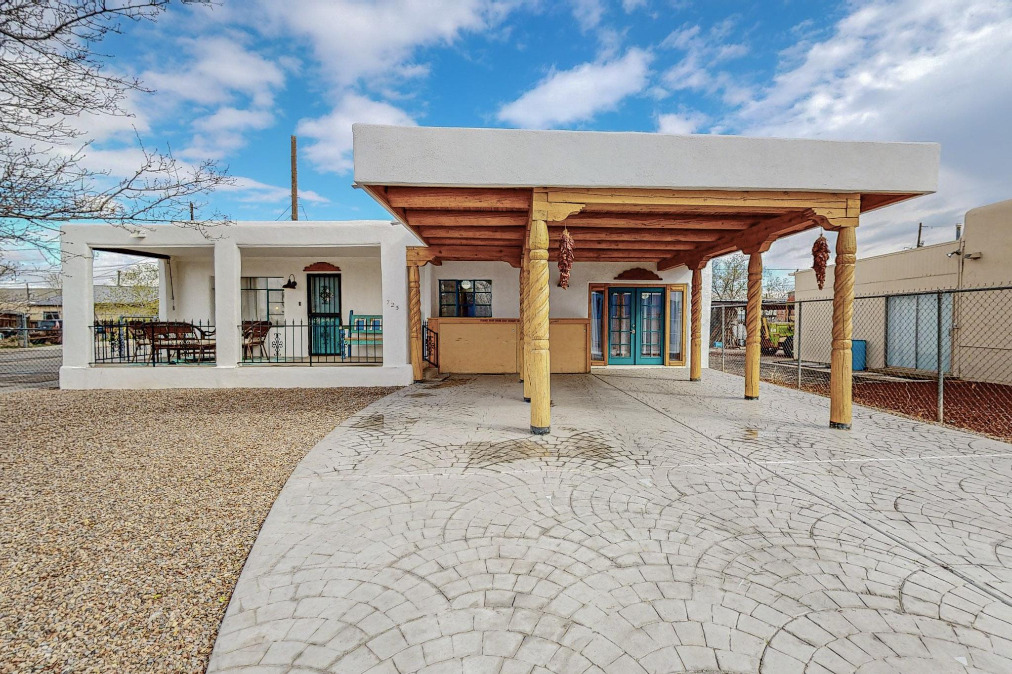 Pride of ownership shines though in this stylish, vibrant, Southwest dream home. Tired of high energy bills? This home has owned solar! No stone was left unturned as this home was completely upgraded with high-end materials and superior craftsmanship. The garage has been turned into a luxurious Primary bedroom suite, with Kitchenette, dining area, and bathroom. The suite has its own private entrance and can be sealed off if desired. There is a separate charging station at each of the two car ports for your electric vehicle charging. Drive on sunshine! Close to freeways, 5 minutes from Old town and downtown. Don't miss your chance to live in your SW dream home!