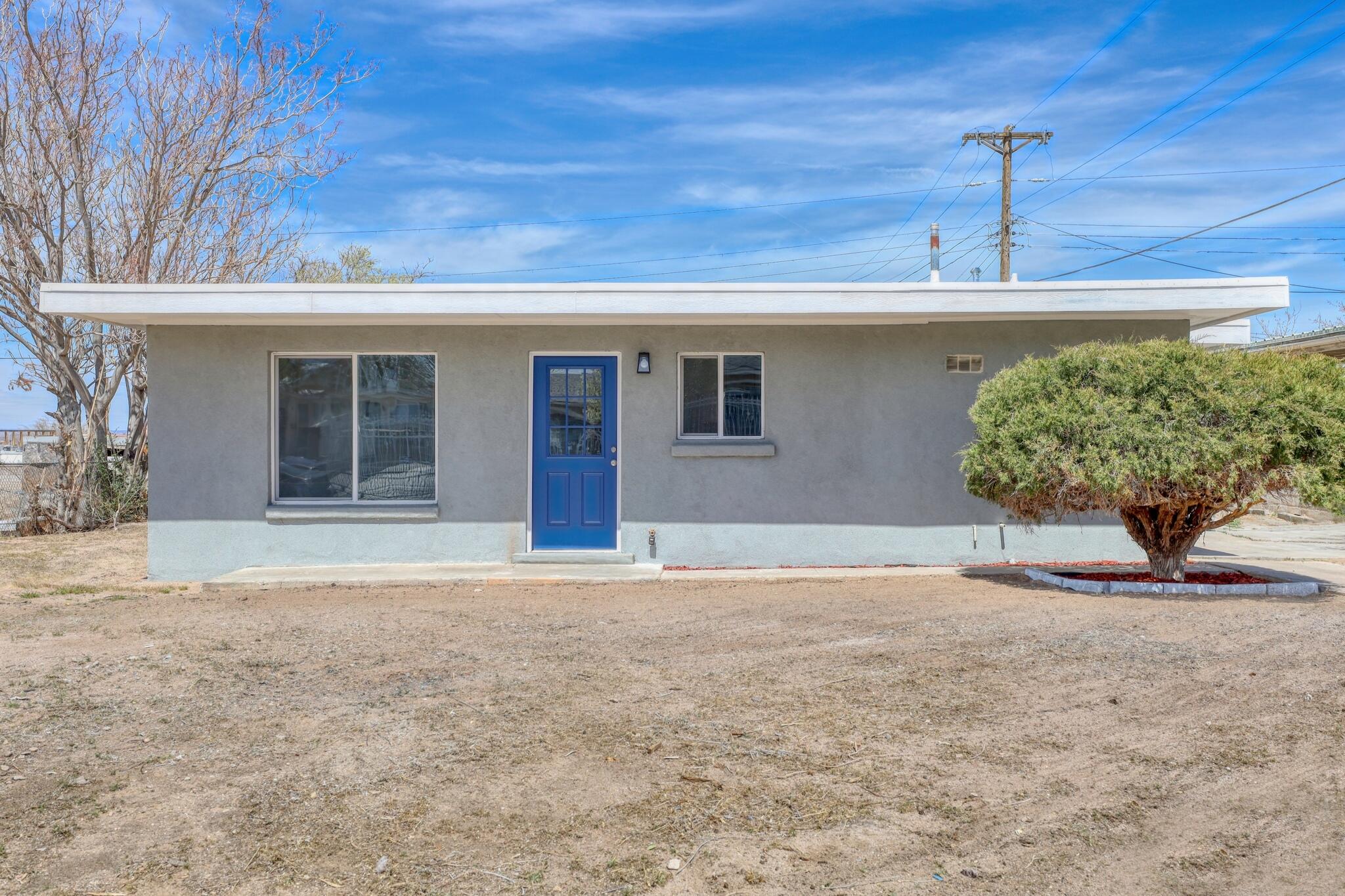 WELCOME TO THE BLUE-DOOR BEAUTY YOU'VE BEEN WAITING FOR! Offering $3,000 towards buyer interest rate buy down with acceptable offer--  what's not to love! Behind that bold entrance lies a home completely transformed--fresh stucco wraps the exterior, updated windows invite light into every room, and modern mini splits keep the space perfectly comfortable. Step onto modern laminate flooring with updated electrical and plumbing systems! This home provides  the confidence of a solid foundation. The kitchen shines with marble counters and sleek finishes, while the bathrooms have been fully redone for everyday luxury. Come make this house your home! Call today for more info and to schedule your visit!