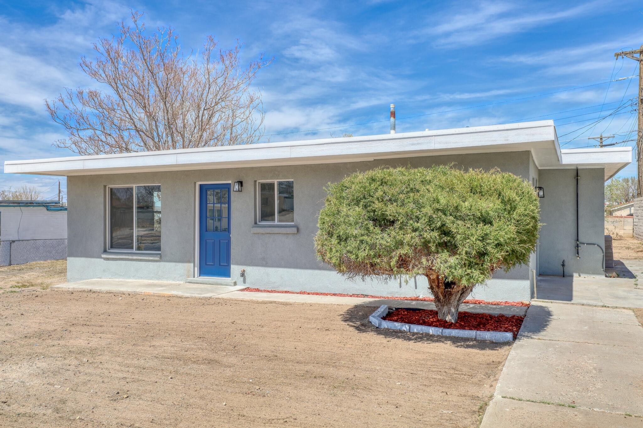 This house comes with a REDUCED RATE as low as 5.875% (APR 6.165%) as of 05/01/2025 through List & Lock(tm) WELCOME TO THE BLUE-DOOR BEAUTY YOU'VE BEEN WAITING FOR! --  what's not to love! Behind that bold entrance lies a home completely transformed--fresh stucco wraps the exterior, updated windows invite light into every room, and modern mini splits keep the space perfectly comfortable. Step onto modern laminate flooring with updated electrical and plumbing systems! This home provides  the confidence of a solid foundation. The kitchen shines with marble counters and sleek finishes, while the bathrooms have been fully redone for everyday luxury. Call today for more info!