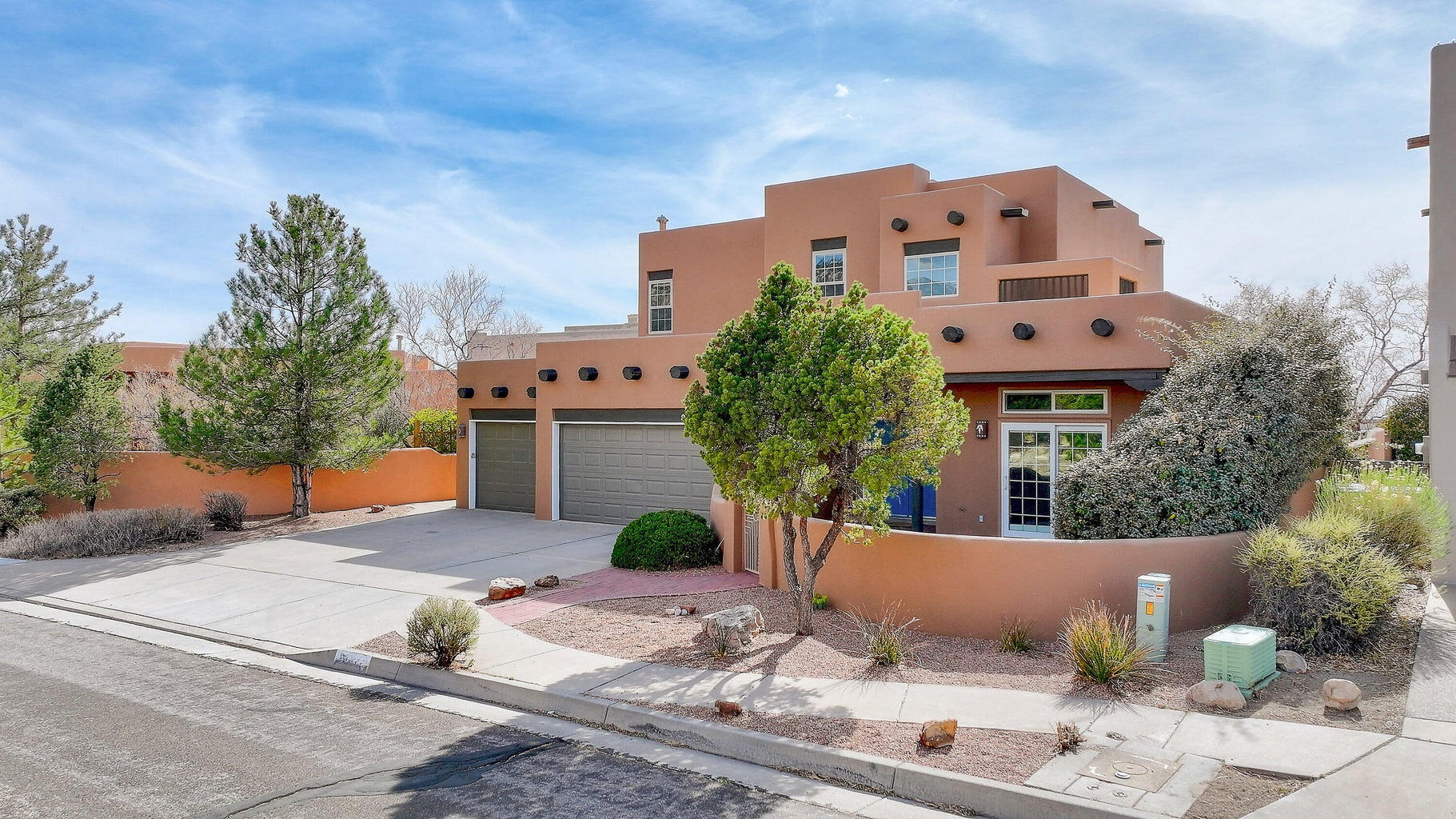 High Desert SW  Pueblo Custom with panoramic city , mountain & sunset views. Large Entertainers dream back yard  with views , expansive  patio w  kiva fireplace & banco, pool with auto cover ( 3 2025) )cabana.Seller Investments:  Reroof 2024. Restucco 2024. Replaced all windows & Slider doors .Replaced Pool Cover 2025 Replaced tankless water heater. Some repaint.  Added mini splits. Upgraded 3 zone irrigation system lower back yard. 2025 . Quality Home .  Private courtyard entry , exposed adobe accents, raised T & G ceilings with vigas, large Master Chef kitchen with island & bar. 2 fireplaces. plus outdoor kiva fireplace Expansive Greatroom, Formal Dining Area   , Separated  MBR with kiva fireplace luxury bath  , Separated Office .  Family Room & 3 large guest bedrooms & 2 baths upstairs