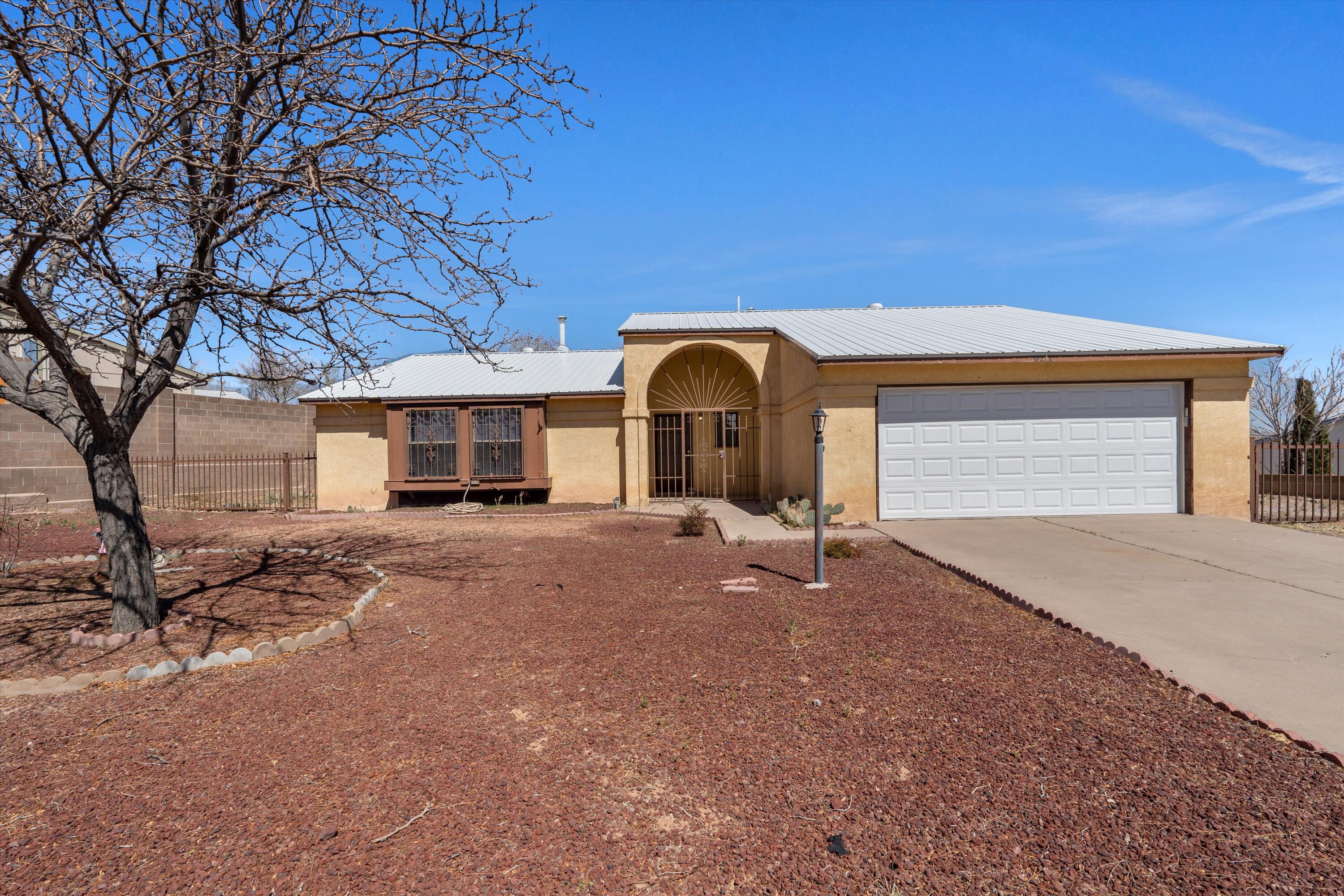 Welcome to this delightful 3-bedroom, 2-bathroom home, offering both comfort and convenience. Featuring durable vinyl flooring and a new metal roof (2022), this home is designed for easy maintenance. The spacious backyard provides ample room for outdoor enjoyment, while RV access in the front yard adds extra parking and flexibility. With great potential and a well-thought-out layout, this home is ready for your personal touch. Property sold ''as-is''. Don't miss out--schedule your showing today!