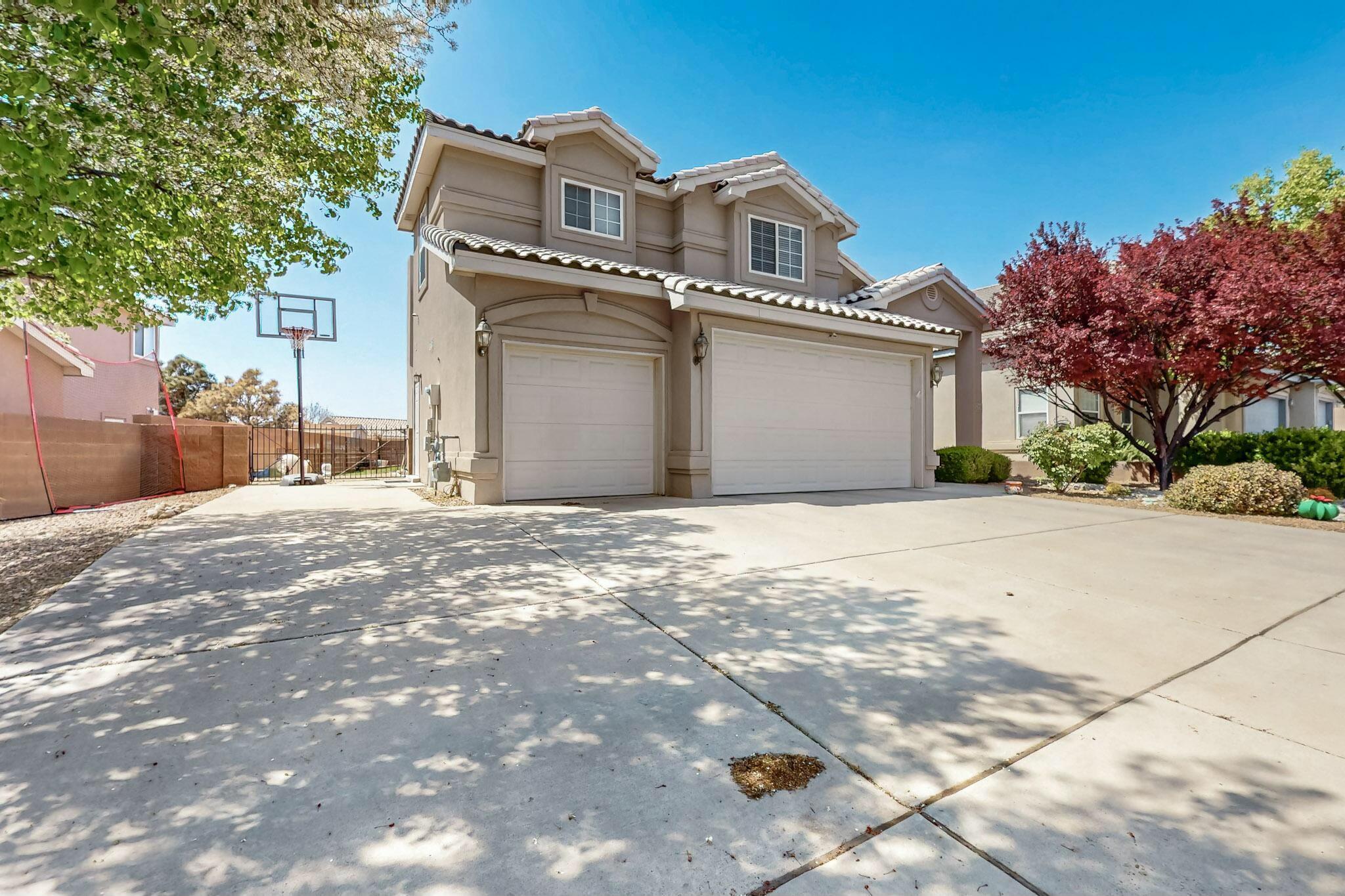 Open House April 12th  12-2pm. Welcome Home! Beautiful 3-bedroom, 3-bath home with a spacious 3-car garage in highly sought after NE Heights neighborhood! Home features new vinyl plank flooring on stairs and upper level, and new stone countertops in upstairs bathrooms! The bright kitchen flows seamlessly into the dining area, leading directly to the backyard for easy indoor-outdoor living. Extra living space in the upstairs loft! Retreat to the private primary suite complete with its own balcony, ideal for enjoying your morning coffee or unwinding at sunset. A covered patio opens to a beautifully landscaped yard, offering plenty of space for entertaining, play, or peaceful moments. This home blends functionality and charm in every corner. Don't miss your chance to make it yours!