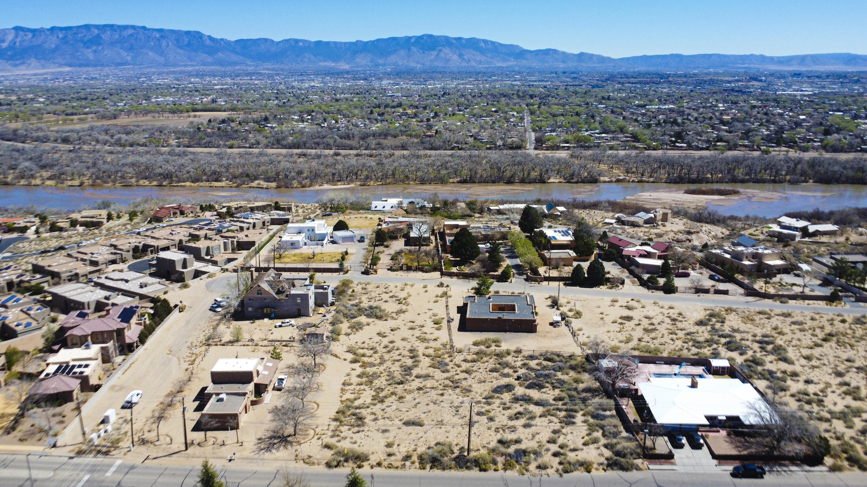 Are you looking for the perfect place to build your dream home? Look no further! This lot, approximately .34 ac provides great potential views of the Bosque and a picturesque backdrop of the Sandia Mountains for your future residence. Nestled in tranquil surroundings, this property boasts unique features that cater to a variety of tastes and preferences. Close by you will find a range of features and amenities designed to enhance your living experience. From well-maintained access roads and utilities to a community park and biking and walking trails, we ensure that you have everything you need to create your own soothing environment that promotes a convenient and comfortable living environment.  You will also find a range of schools and a variety of stores and restaurants