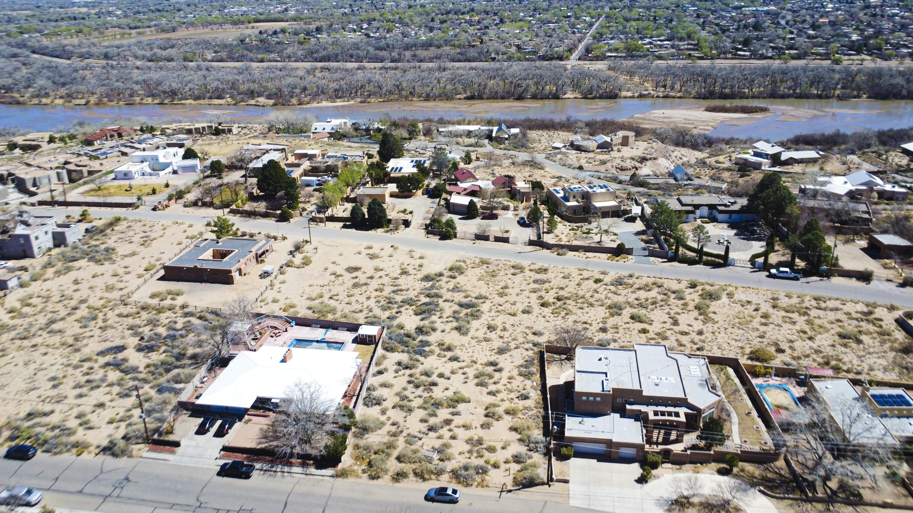 Are you looking for the perfect place to build your dream home? Look no further! This lot, approximately .29 ac provides great potential views of the Bosque and a picturesque backdrop of the Sandia Mountains for your future residence. Nestled in tranquil surroundings, this property boasts unique features that cater to a variety of tastes and preferences. Close by you will find a range of features and amenities designed to enhance your living experience. From well-maintained access roads and utilities to a community park and biking and walking trails, we ensure that you have everything you need to create your own soothing environment that promotes a convenient and comfortable living environment.  You will also find a range of schools and a variety of stores and restaurants