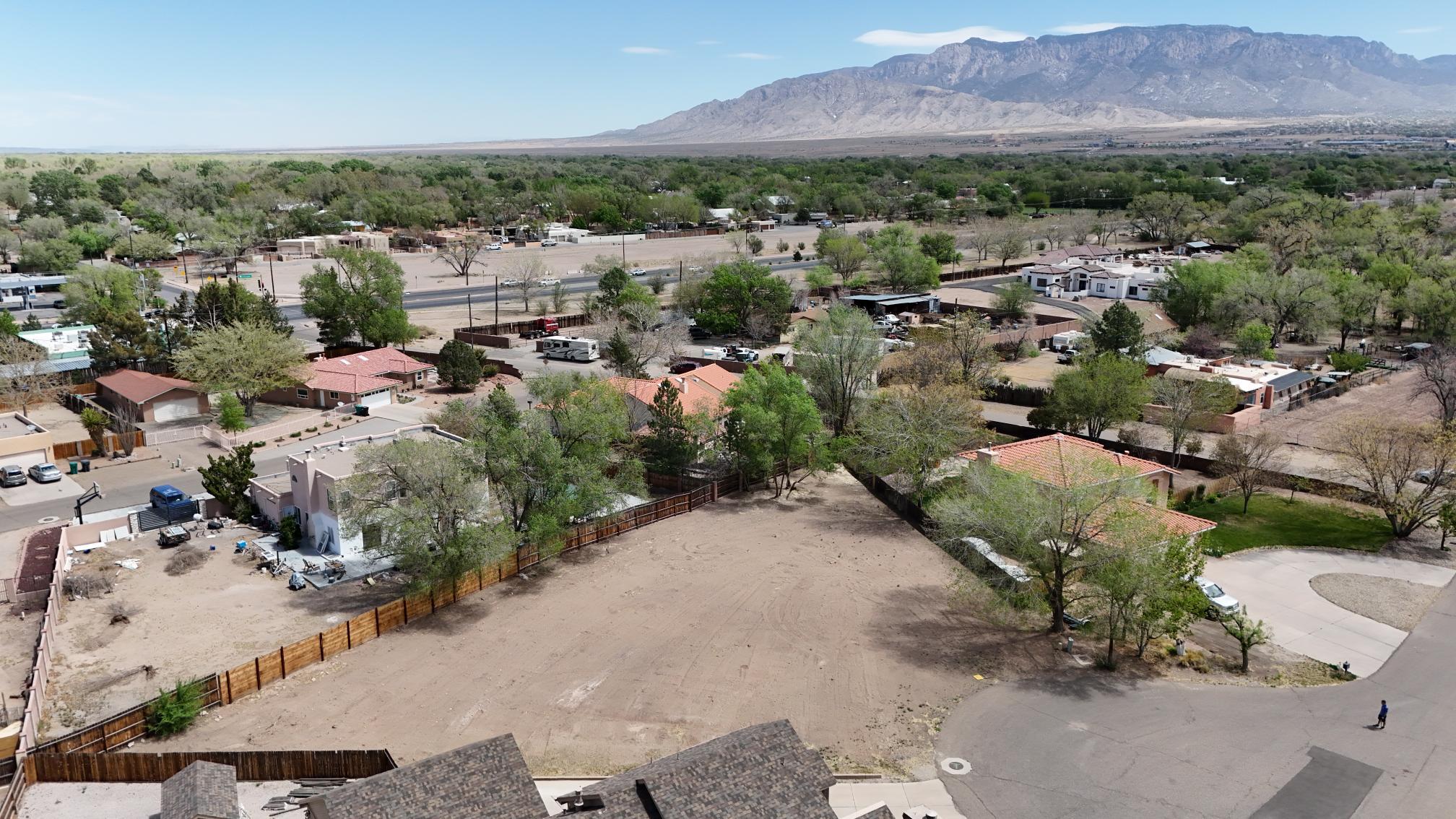 Discover the perfect blend of nature and convenience with this spacious .42-acre lot located in the heart of Albuquerque's highly sought-after North Valley. Just minutes from the scenic Bosque Trails, this property offers the ideal setting for your dream home or investment project with access to city utilities.Surrounded by mature trees and peaceful surroundings, yet close to shopping, dining, and major roads, this lot provides the best of both worlds.Don't miss this rare opportunity to own a piece of the North Valley--build the lifestyle you've always wanted!