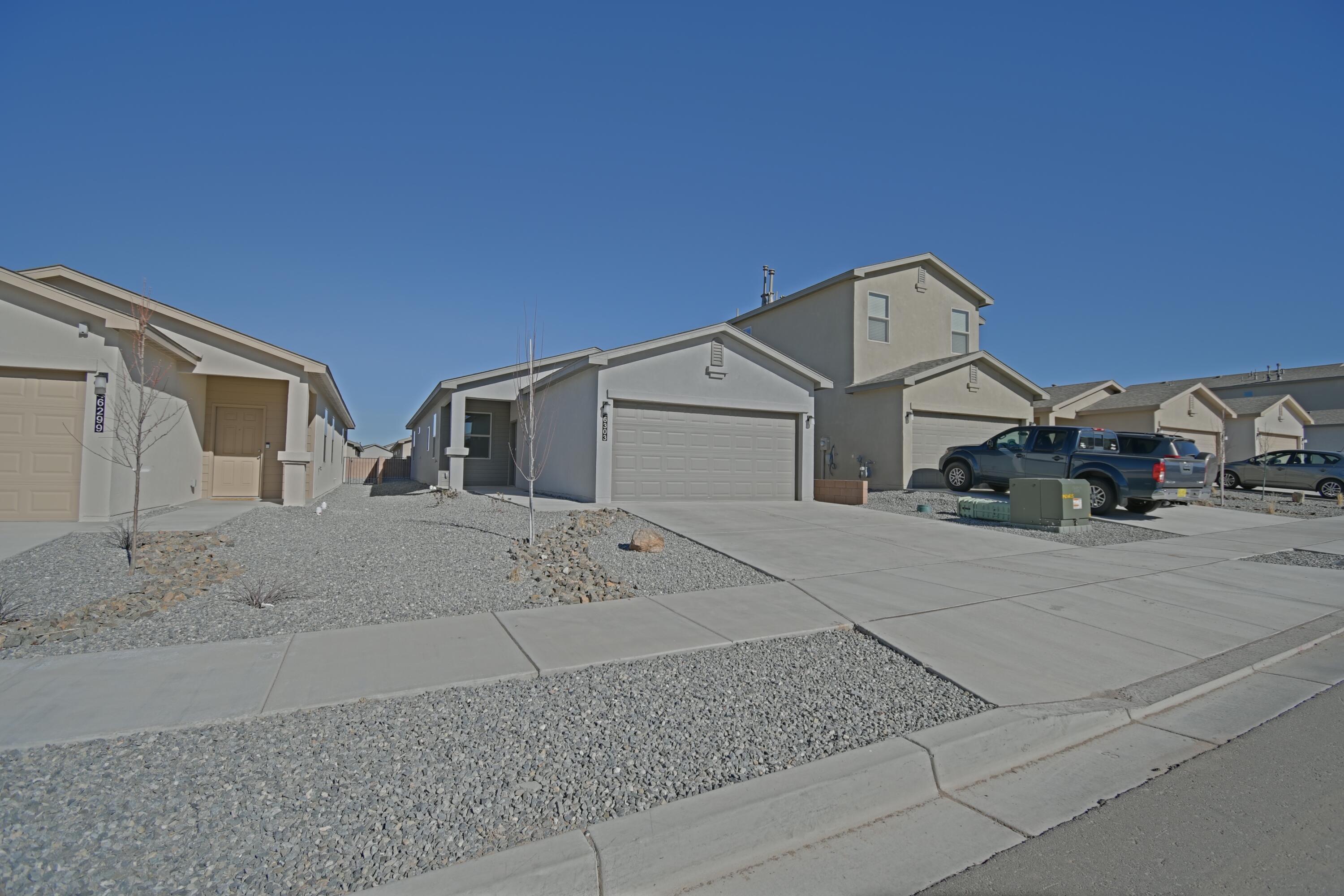 Welcome to this beautiful three-bedroom, two-bathroom home located in the desirable Rio Rancho, NM. This house offers a comfortable and spacious living environment for anyone seeking a new place to call home. The kitchen is equipped with modern appliances including a refrigerator, gas stove, dishwasher, and garbage disposal, making meal preparation a breeze. With refrigerated A/C and central forced air, you can enjoy a comfortable temperature year-round. The two-car garage provides ample space for parking and storage. Step outside onto the covered patio and relax or entertain guests in the fresh air. Inside, the great room offers a versatile space for gathering and creating lasting memories. The primary bedroom features a walk-in closet, providing plenty of storage for your belongings.
