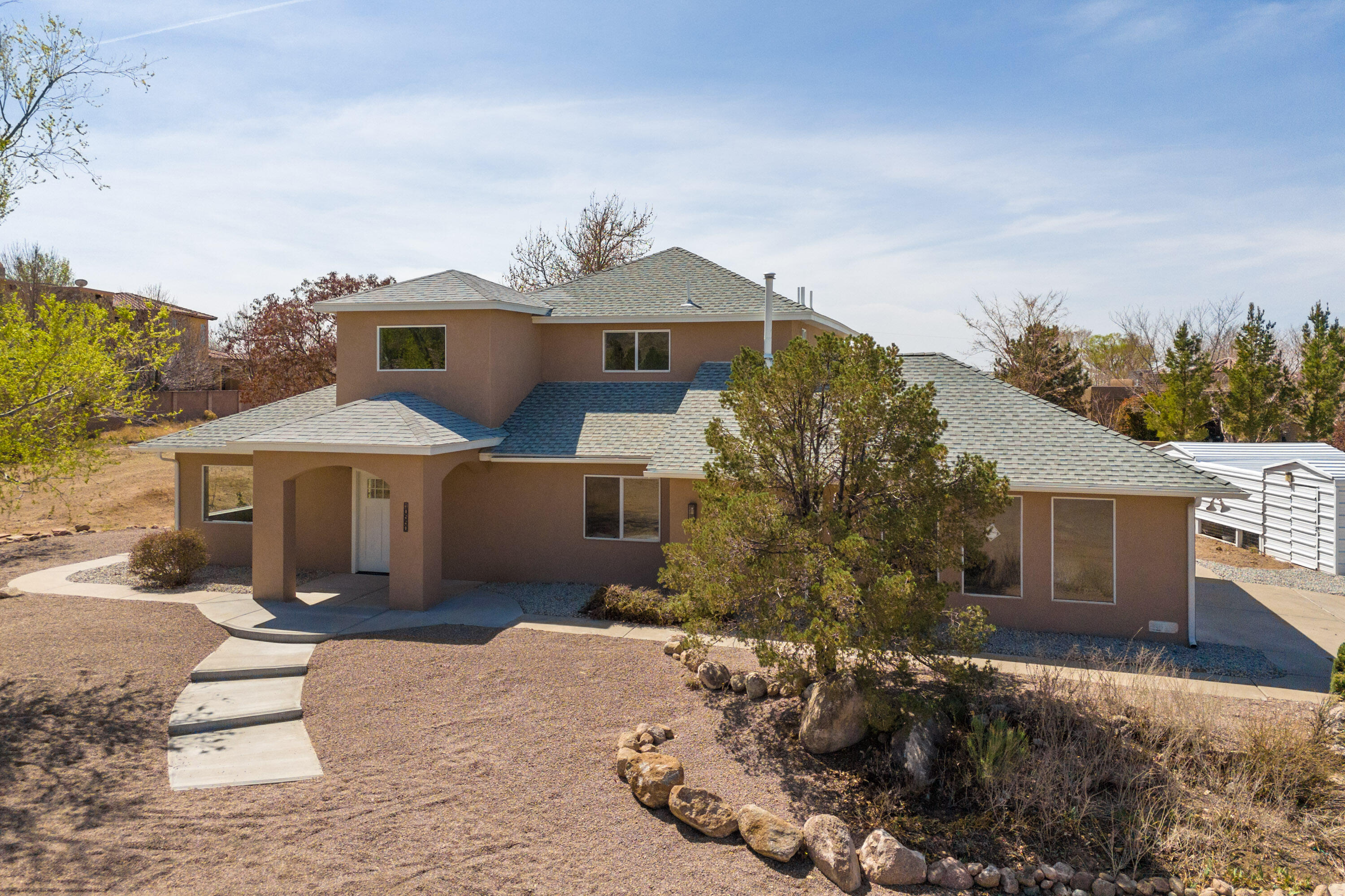 Stunning fully renovated 4-bedroom, 4-bath home in North Albuquerque Acres! Boasting an open floor plan, this spacious beauty offers modern finishes throughout. Three of the bedrooms feature en-suite bathrooms for ultimate privacy and convenience. Perfect for entertaining, the home seamlessly blends style and functionality. Enjoy the peaceful neighborhood while being close to all amenities. This home is a true gem, offering luxury and comfort in one of Albuquerque's most desirable areas!