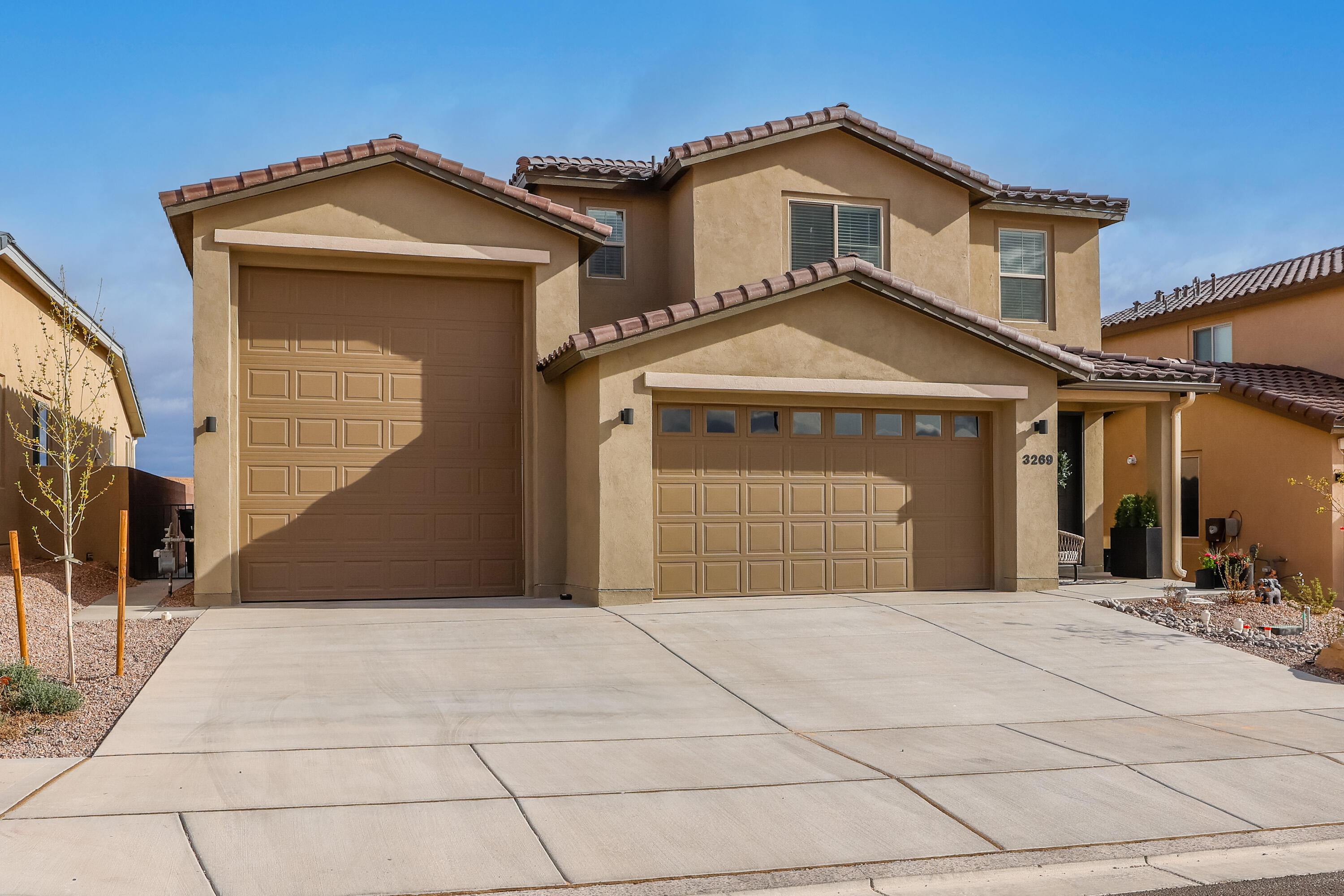 Arguably one of the most beautiful, serene views from the immaculately  manicured backyard and living spaces of this spectacular home.  Less than a year old, this home has nearly brand new everything to include backyard fire pit and cozy pergola to enjoy those New Mexico evenings!  The enclosed RV garage is a must-see! Seller is leaving all appliances to include the refrigerator, washer, and dryer. Plenty of space to spread out in the 4 bedrooms plus an upstairs loft.  The Owner's suite is tucked away downstairs while the other bedrooms are upstairs.  As part of your HOA benefits, you have access to the community center, indoor and outdoor pools, fitness center, yoga studio, kitchen/social area, park, ball courts, playground, ramadas and picnic areas.  This one shows like a model home!