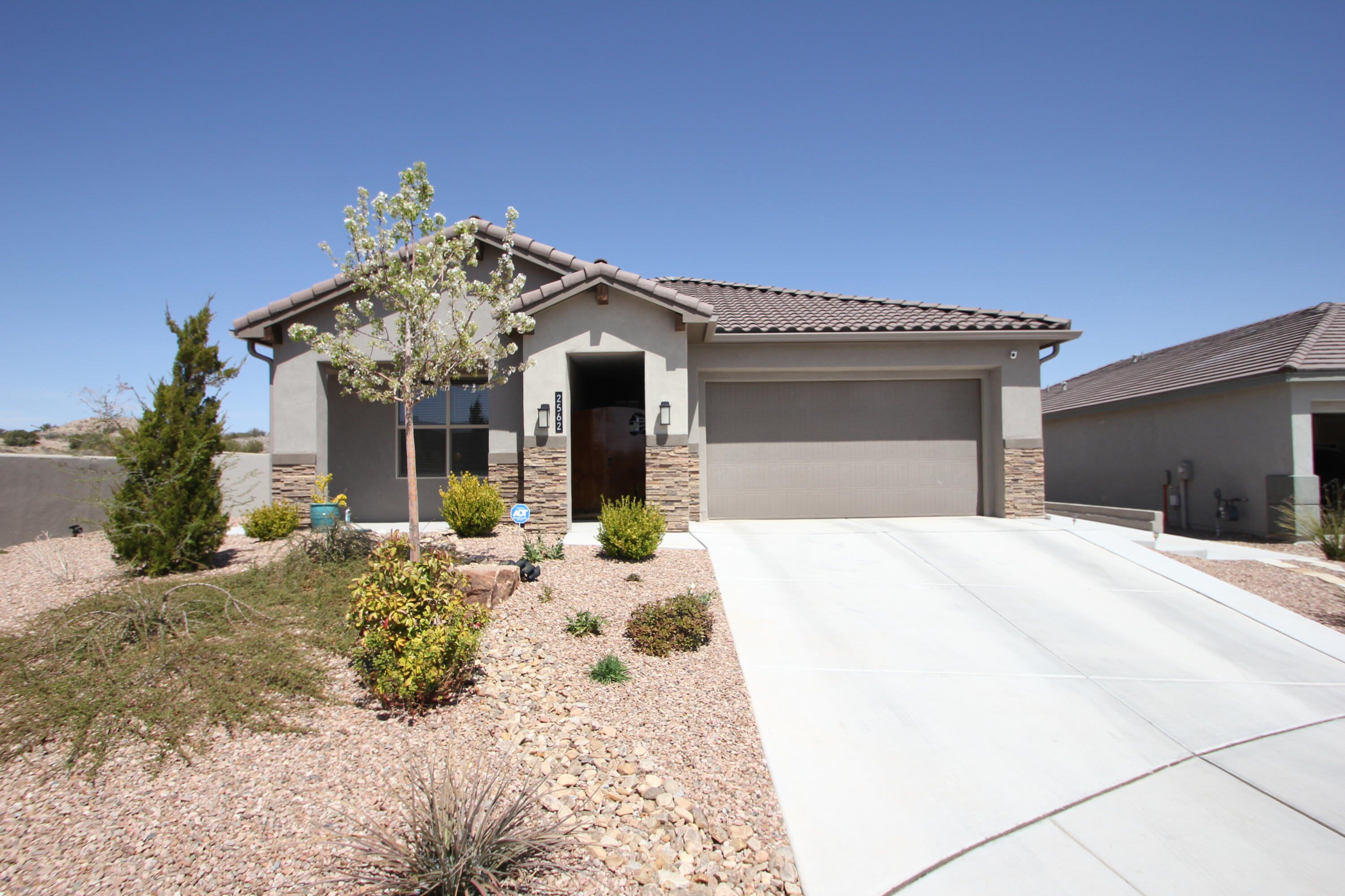 This beautifully upgraded home boasts 4 spacious bedrooms and 2 bathrooms, offering a perfect balance of comfort, luxury, and sustainability. Situated on a fully landscaped .22-acre lot, the property is designed for ultimate outdoor enjoyment and energy efficiency. solar system that powers both the home and an electric vehicle (EV)220-volt outlet .Large covered back patio perfect for entertaining. Built-in griddle for cooking outdoors. 5' gas fireplace . 80'' Fan to keep things cool.Fully automated commercial-grade screens that block both the sun and wind, creating a comfortable and private space. The home is packed with upgrades that make it stand out. This home truly has it all--space, style, energy efficiency, and luxury. It's a must-see! OVER $160,000 IN UPGRADES