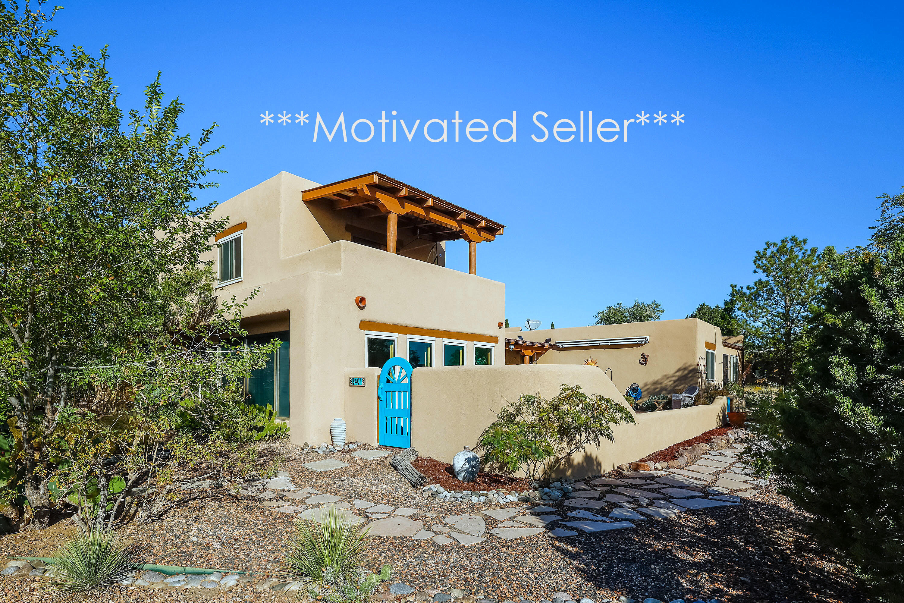 Motivated Seller!  Perched above the Rio Grande with breathtaking views of the Bosque, downtown Albuquerque, and the Sandias, this custom Southwestern home is a rare find. Rich in character, it features exposed adobe walls, raised beamed ceilings, and two serene courtyards. The spacious gourmet kitchen offers granite counters, a cooktop island, and abundant custom cabinetry. Two primary suites--one up, one down--provide flexibility, each with private baths and outdoor access. The upper suite boasts hardwood floors and a view deck perfect for sunrise or sunset. Passive solar design enhances comfort and efficiency.