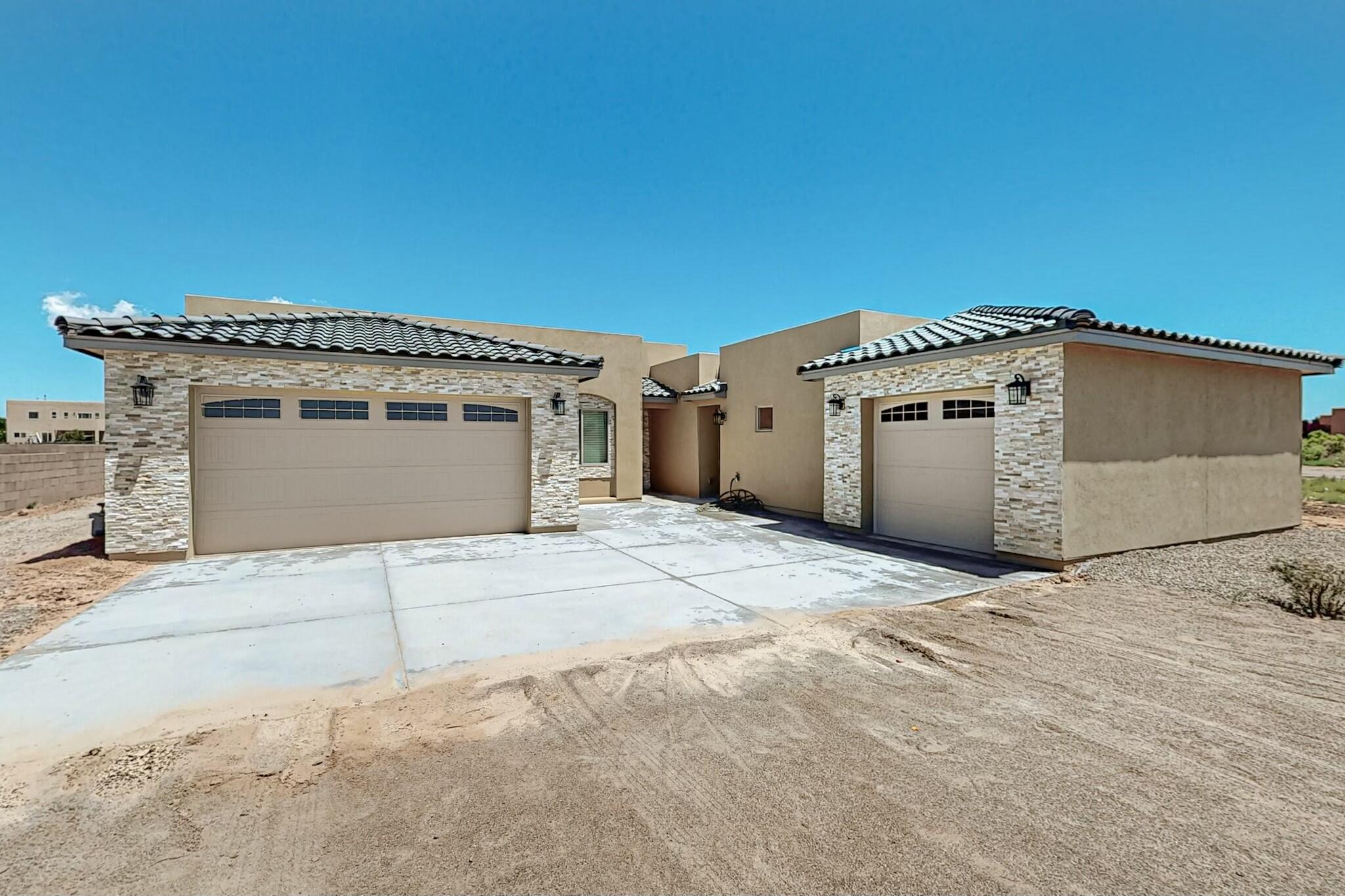 Stunning New Build Home on Half an Acre in Rio Rancho! This gorgeous new construction is the perfect blend of modern comfort and spacious living, 4 Bedrooms in the main home,The primary suite is a true sanctuary, complete with two walk-in closets, a freestanding tub for ultimate relaxation, and a walk-in shower.  Fully equipped with brand-new appliances ready for you to move, walk in pantry. This beautiful home offers plenty of space for entertainment and guests. Attached **Bonus Studio**  Ideal for a home office, creative space, or guest space.