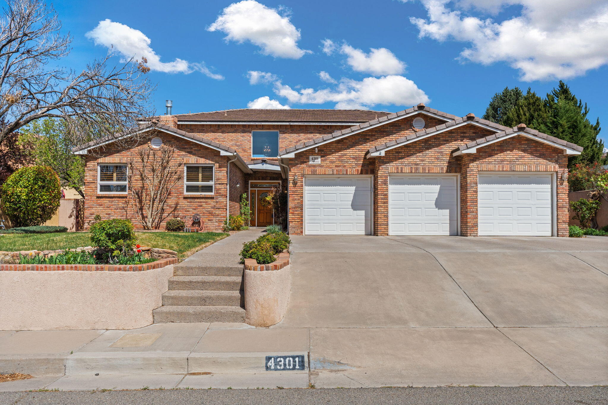 Situated just around the corner from Altura Park, this custom brick home combines classic charm w/ thoughtful updates, one of the newer homes in a well-established neighborhood & lovingly maintained by its original owner. Step inside to soaring 20ft ceilings, a dramatic stone fireplace, & natural light pouring in through clerestory windows. Hardwood floors, custom plantation shutters, & a loft w/ catwalk bring style & elegance throughout. The kitchen features rustic travertine tile, granite counters, & rich maple cabinetry. Spacious bedrooms, oversized walk-in closets, & new flooring upstairs make it easy to feel at home. W/ 2 refrigerated air units, tile roof, 723 sqft 3-car garage & beautifully landscaped yards w/ rose bushes/almond tree, this home is a rare find in the heart of it all.