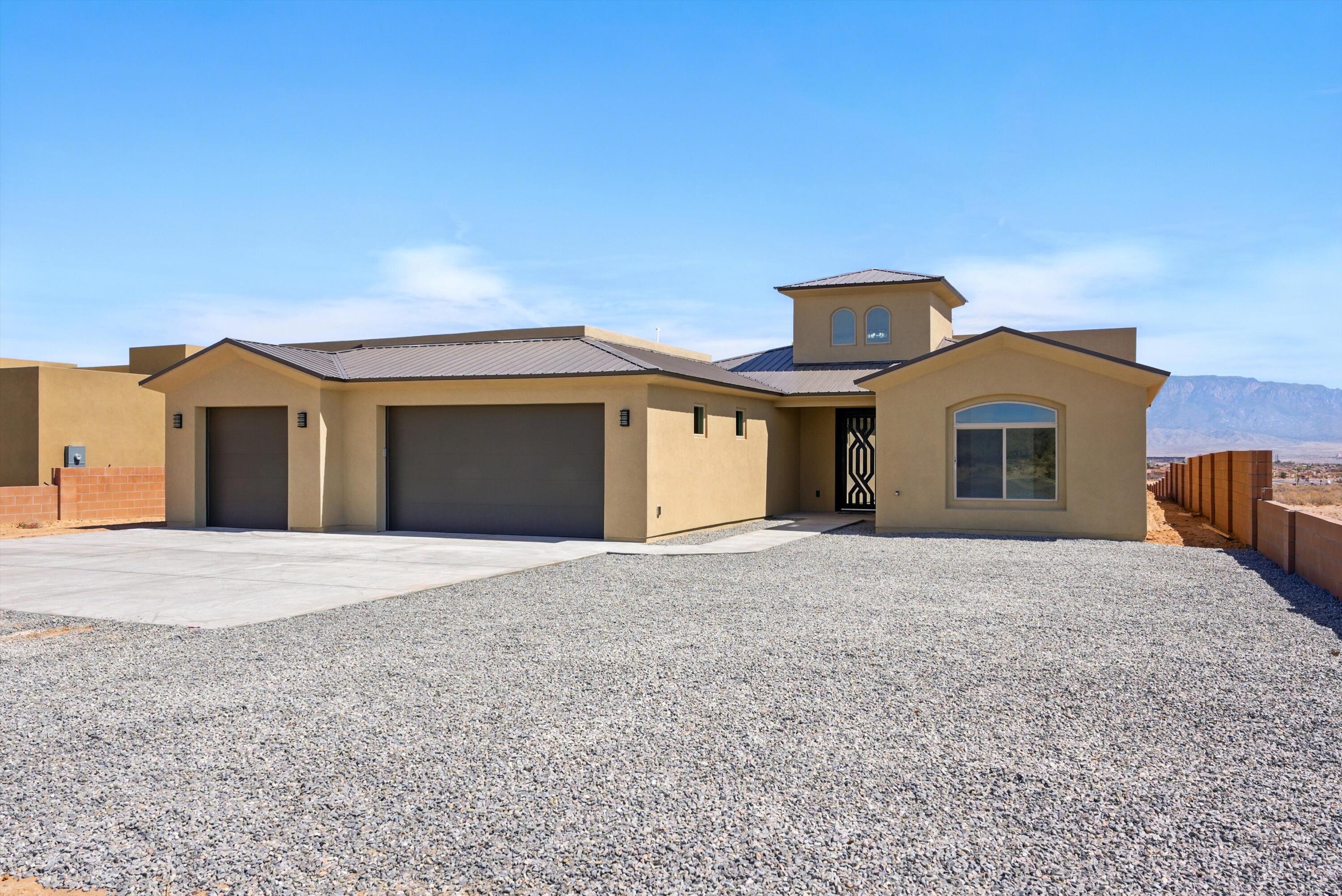 Experience luxury living in this brand-new custom home on a spacious half-acre lot in Rio Rancho! Designed for both style and comfort, this stunning home boasts breathtaking mountain views and an open, light-filled floor plan. High-end finishes and expert craftsmanship are showcased throughout, from the gourmet kitchen to the elegant primary suite. Enjoy peaceful surroundings while being just minutes from top-rated schools, medical facilities, shopping, and dining. With ample space both inside and out, this home is a rare find.  The home is on a half-acre lot and offers backyard access! Don't miss your chance to own this exceptional property--schedule your showing today!