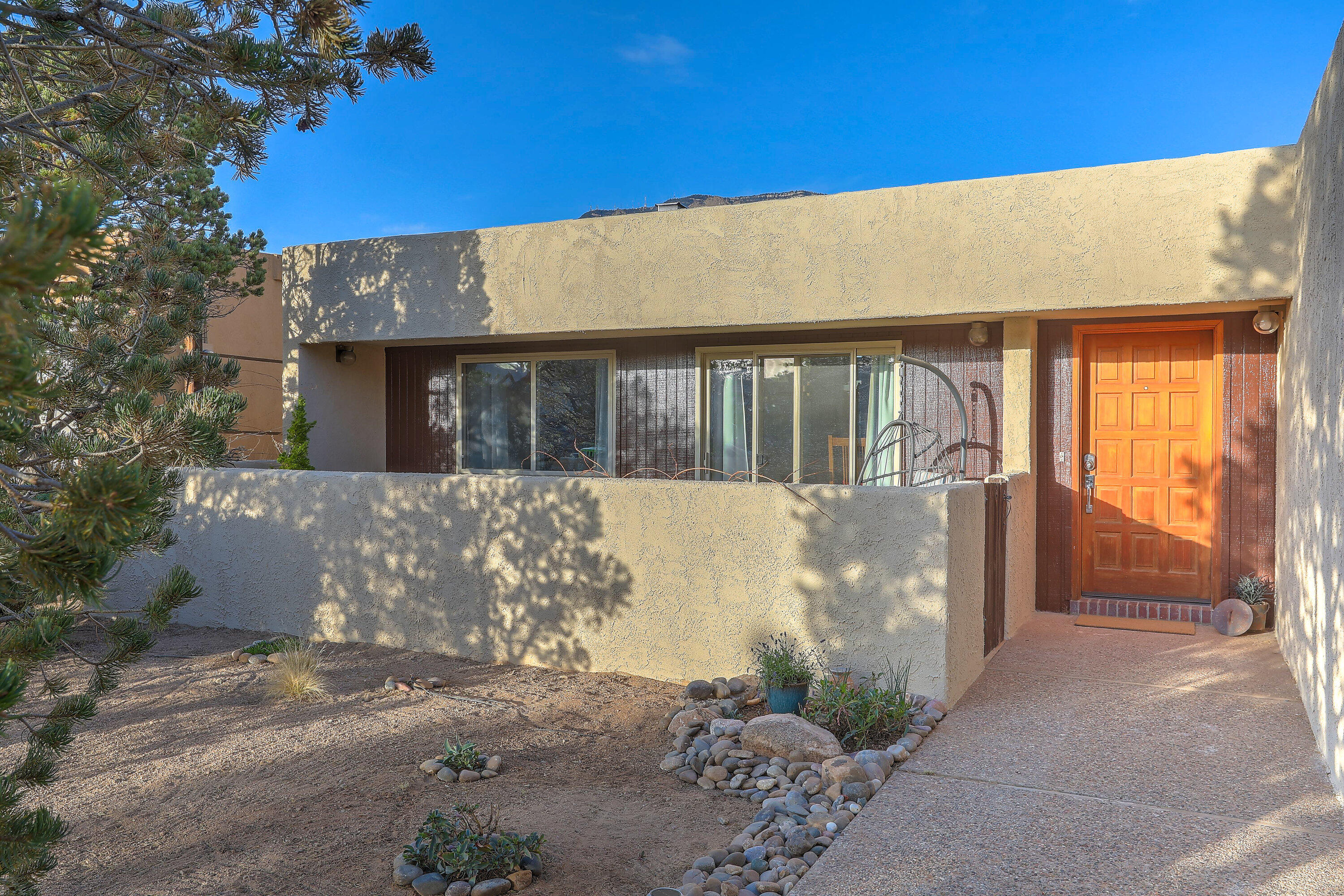 Welcome to 1948 Quail Run Loop -- a beautifully updated single-story home nestled in the coveted foothills of Sandia Heights. This light-filled residence offers sweeping views of the mountains and city lights, with thoughtfully updated touches throughout. The heart of the home is a beautifully remodeled kitchen featuring modern finishes and an open layout perfect for entertaining. Natural light pours into every room, highlighting the elegant design and seamless flow. Enjoy tranquil mornings or vibrant sunsets from your private outdoor spaces. This home is the perfect blend of comfort, style, and breathtaking scenery -- all on one easy-living level.