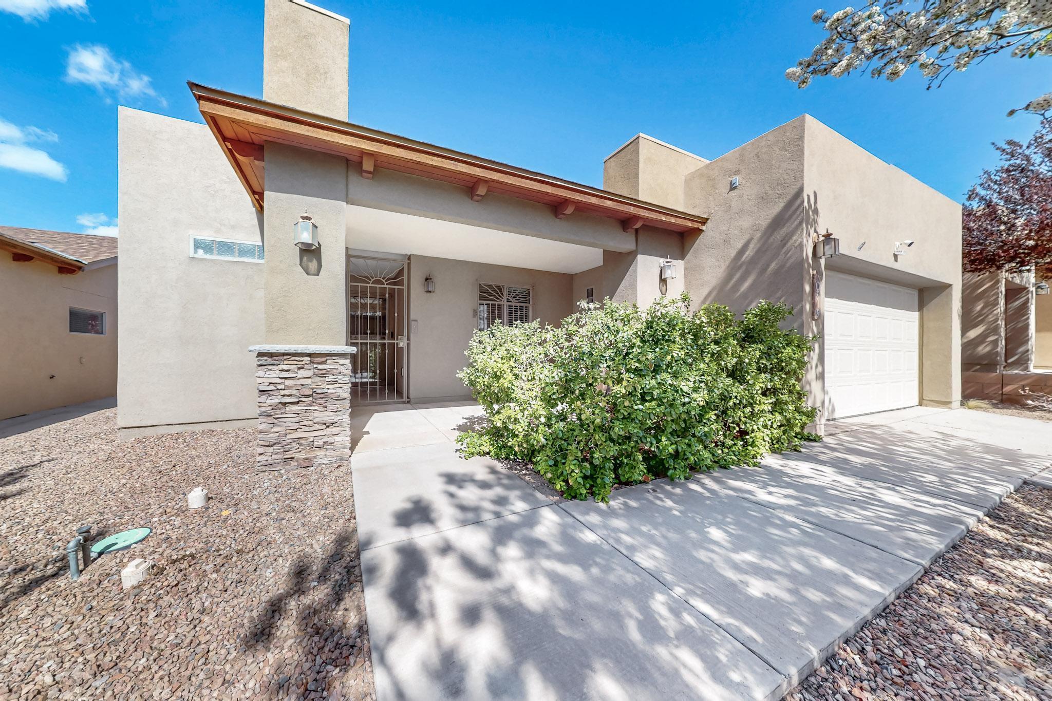 Welcome home to this stunning Green Built Paul Allen-home in Albuquerque's sought-after Saltillo neighborhood! Known for exceptional energy efficiency and quality construction, this home features 2x6 framing, owned solar, an inviting open floor plan, 2 bedrooms, 2 baths, and a cozy living room fireplace. The spacious master suite boasts a walk-in closet, dual vanity sinks, and a separate shower and tub. Step outside to a private walled backyard, perfect for relaxation or entertaining, plus an enclosed patio for extra storage. All appliances convey, making this home move-in ready! Conveniently located just minutes from restaurants, shops, and more. Schedule your showing today!