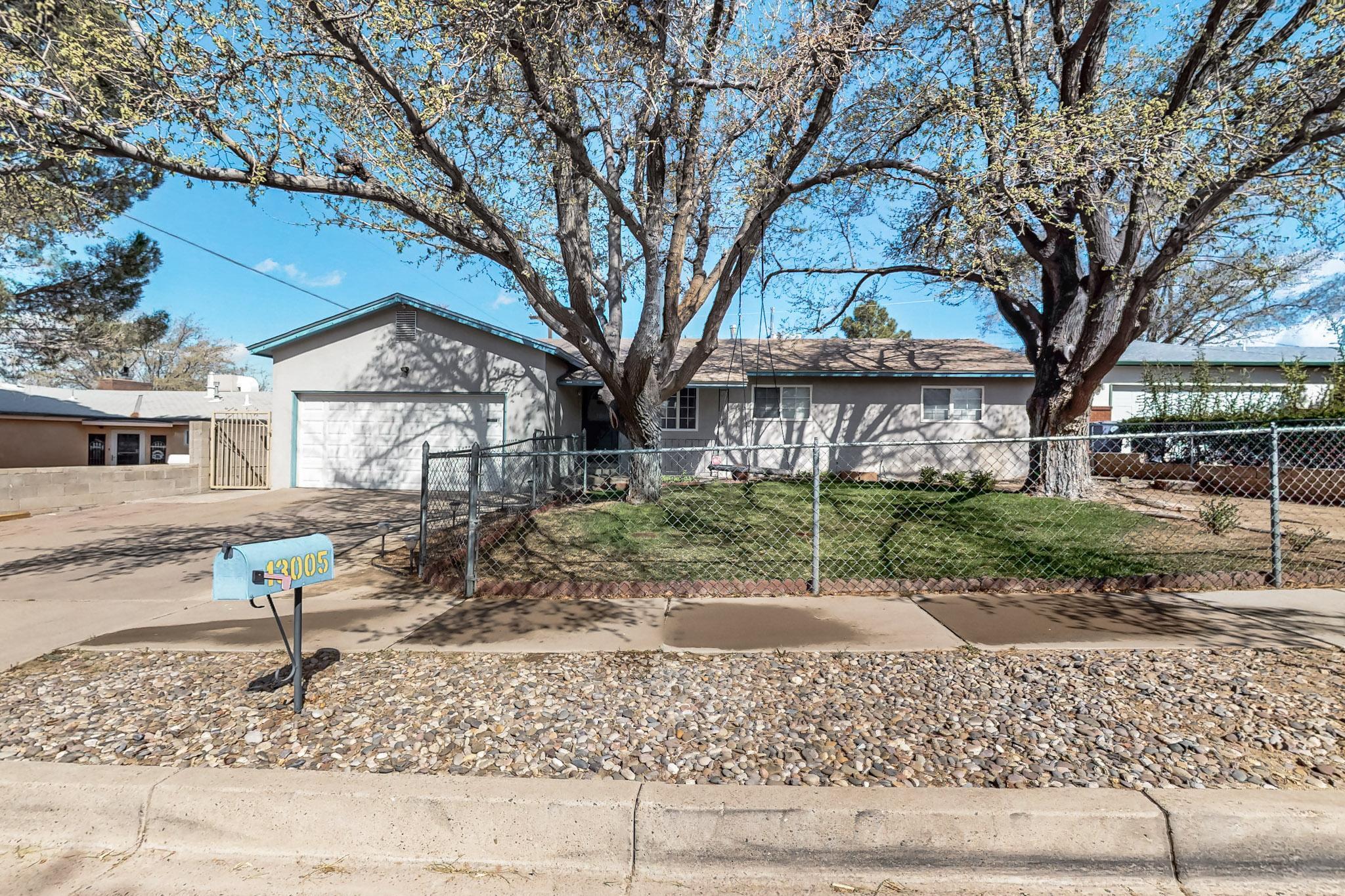 Charming 3 bedroom 2 bath house just waiting for it's new family! Love and care can be seen all over the property and in the home. The living area will keep you toasty warm in the winter month with the wood burning fireplace. The covered patio is perfect for summer get togethers. Enjoy a view of the Sandias from the backyard which is completely walled for privacy. Close to I40 it is a short drive to Kirkland Air Force Base and shops and restaurants. ** There is an underground bunker in the backyard, please do NOT try to move the concrete entrance.