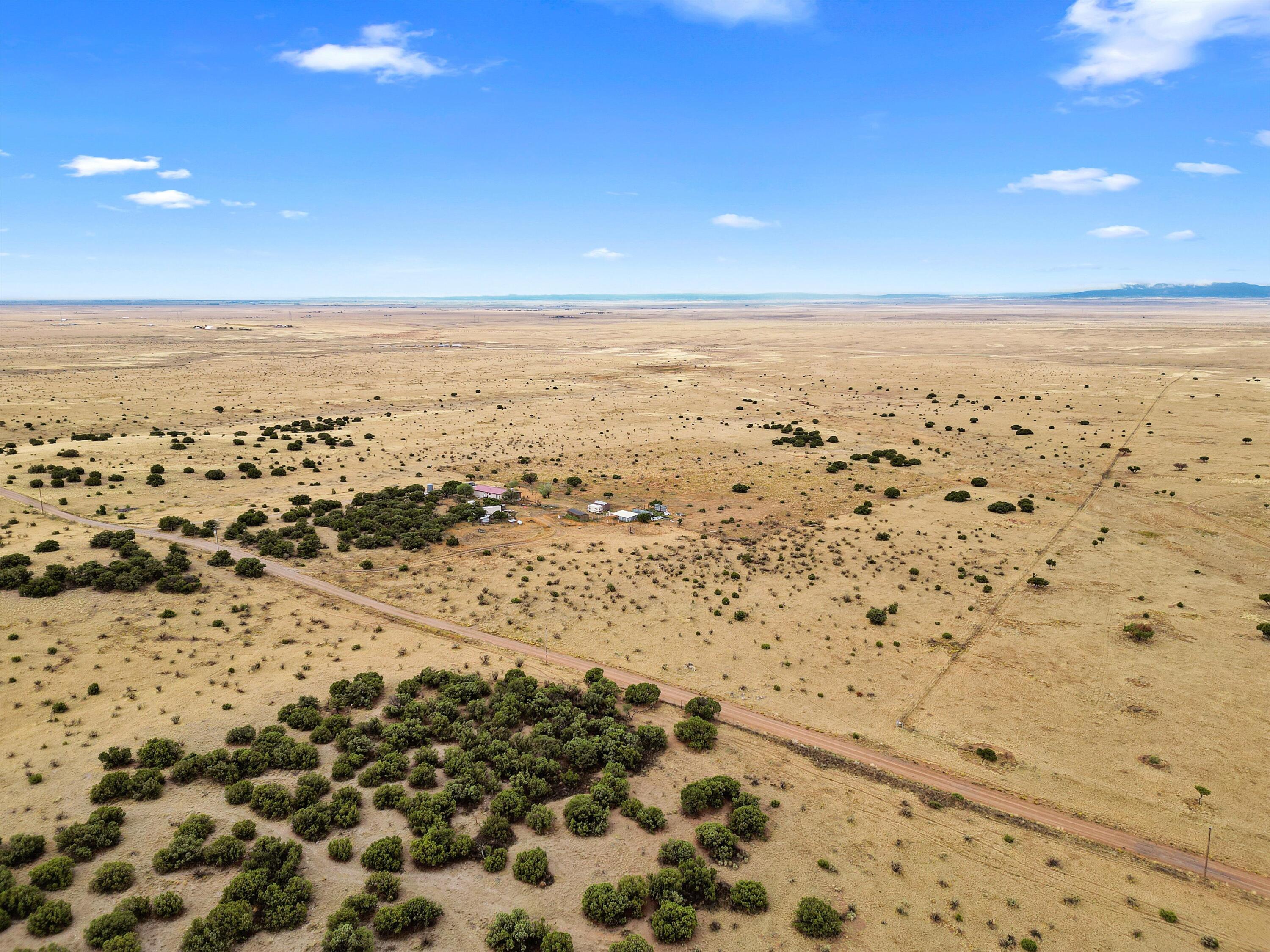Surrounded by the stunning natural beauty this property offers a peaceful and serene environment. With 160 acres at your disposal, you'll have the freedom to enjoy outdoor activities, cultivate gardens, or simply soak in the tranquility of the countryside. It is ready for your horses with a corral and round pen! The potential for creating a unique and personalized living space is immense. With a little TLC this home will truly shine! There is a 5,000 gallon water holding tank, pro panel roof, detached garage, and more! Embrace the opportunity to make this 160-acres your own, and unlock the full potential of this remarkable piece of rural paradise.