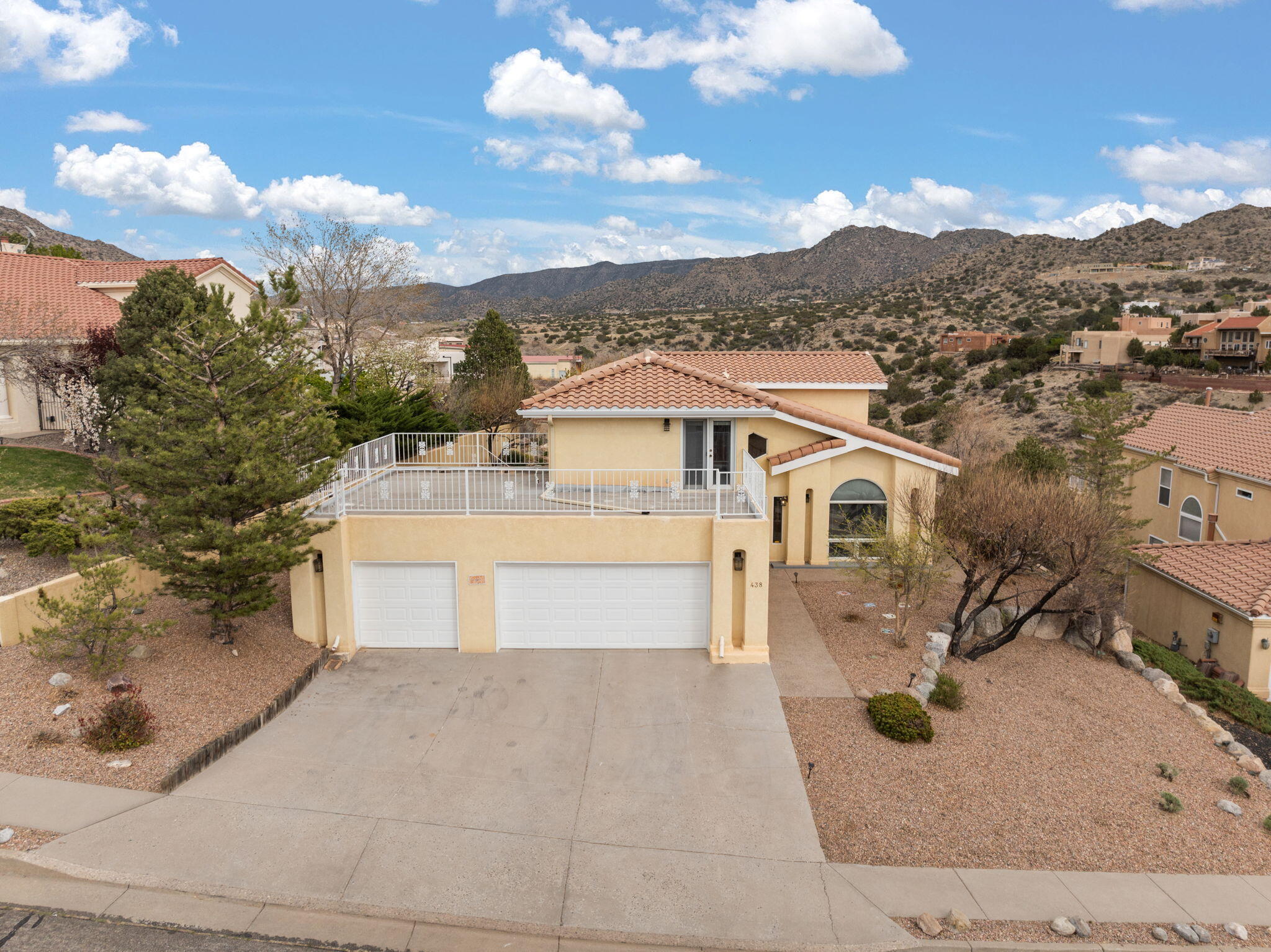 Pre-Inspection available, many repairs completed! New Refrigerated Air/Furnace Combo Unit! Overlooking Tijeras Canyon in the distinguished Four Hills neighborhood, this stately home features soaring ceilings, arched windows, and a sweeping staircase that create a grand first impression. The chef's kitchen features granite countertops, a matching backsplash, stainless steel appliances, and abundant cabinetry. Dual living and dining areas offer flexibility, while dual balconies provide breathtaking mountain views. Newly remodeled bathrooms, a spacious 3-car garage, and gated dog run. Step outside to the private patio overlooking the canyon--perfect for al fresco dining, morning coffee, or sunset cocktails in a serene setting.