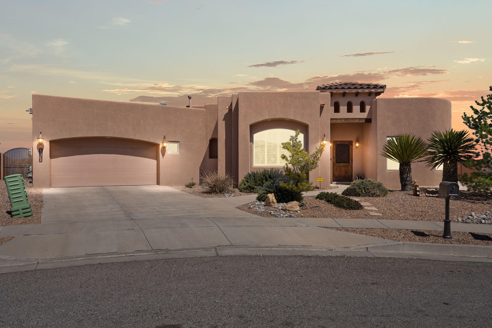 Escape to elegance in this entertainer's dream sitting on .30 acres! Located in an exclusive gated, Rio Rancho community w/ mountain views! Step through the custom Santa Fe door into a stunning foyer w/ rich architectural detail, nichos, & Tongue & Groove ceilings. This single-level home features 4 bedrooms, 3 baths, 3 car tandem garage, formal dining, a spacious great room w/ kiva fireplace & a designer kitchen w/ Bosch appliances, granite counters, 18-ft island, breakfast nook, pendant lighting & skylights throughout. The primary suite offers privacy, direct backyard access, a spa-like bath w/ dual sinks, & walk-in shower. The villa-style backyard is built for relaxing or entertaining w/ 2 seperate yard spaces, 3 covered patios, fireplace, garden, pergola & a gunite spool! Private park!