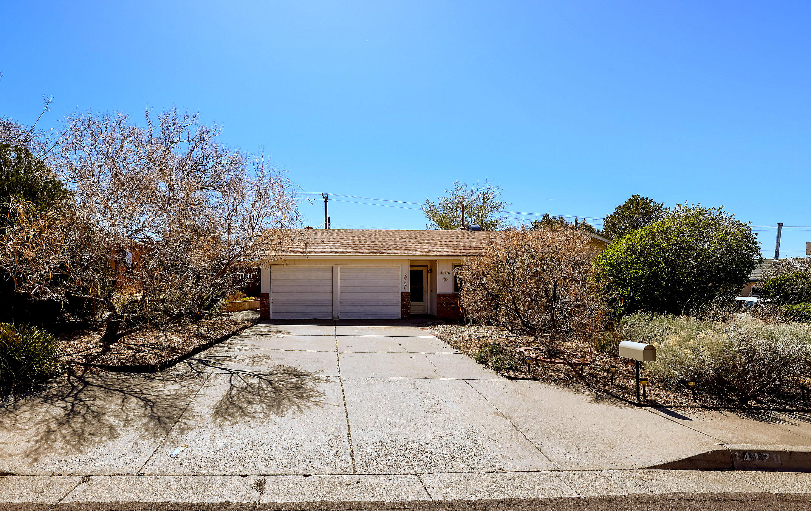 Charming single-story 3-bedroom, 2-bath home nestled in the scenic foothills of the Sandia Mountains. Enjoy easy access to biking and walking trails, all from a quiet, tucked-away street. This well-maintained home features a newer roof (2019), water heater (2018), and an updated primary bath (2022). The kitchen includes a cozy breakfast nook and flows seamlessly into a welcoming dining area. The spacious living room is perfect for relaxing or entertaining and opens to a private backyard retreat. An attached two-car garage offers space for vehicles, gear, or hobbies. Located east of Tramway, this desirable area provides quick access to I-40, Sandia Labs, Kirtland AFB, and UNM. A great opportunity in a sought-after location--schedule your showing today! Priced to sell!