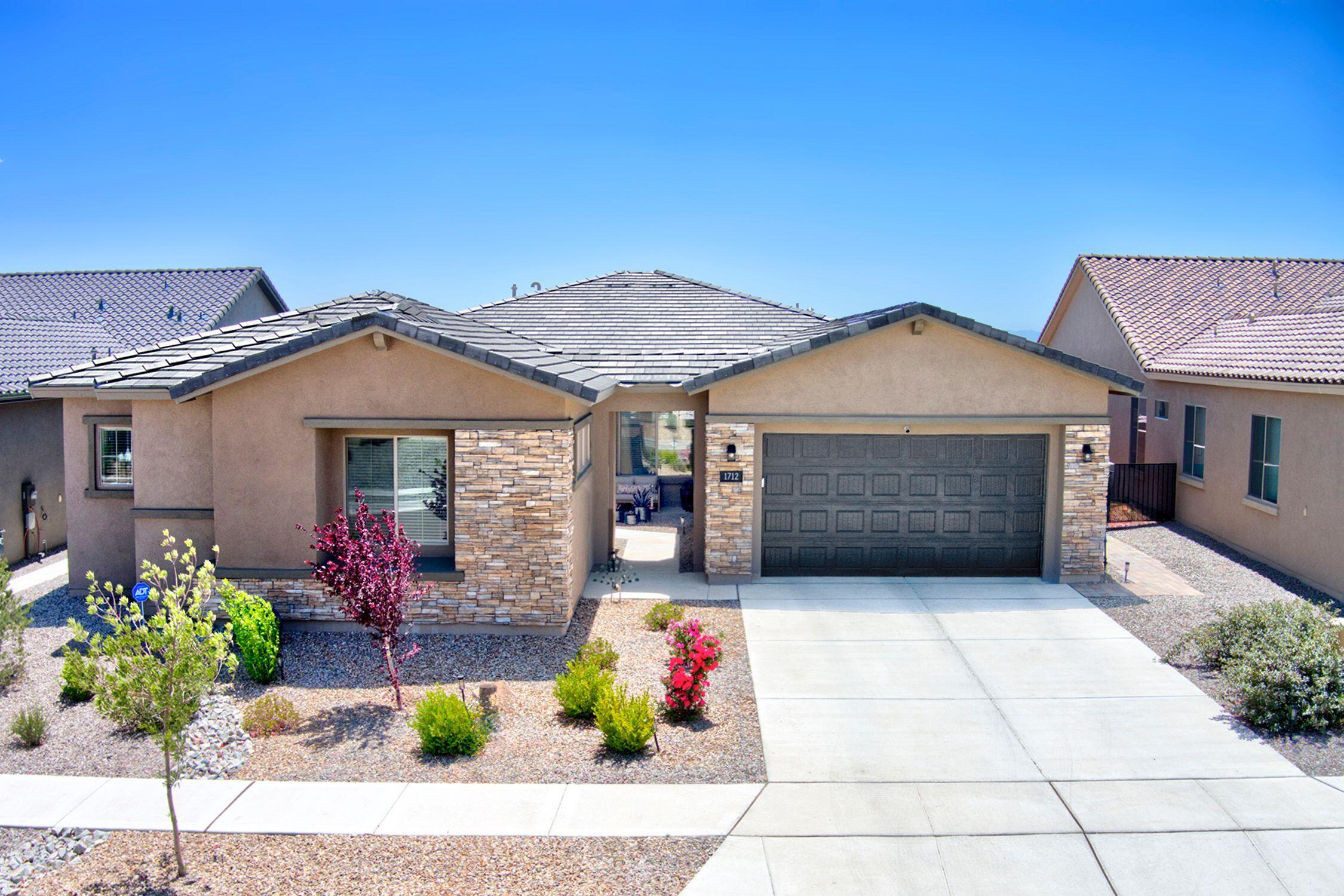 Multi Gen single level Floor Plan w 2 primary suites on an elevated VIEW LOT is approximately 15 minute commute to UNM and Presbyterian hospitals.  Seller did so many thoughtful upgrades to this incredible home including imported porcelain flooring in the bedrooms and office, stylish glass tiles add flair to the kitchen and bath and  professionally landscaped dynamite backyard. This gem has all the style & amenities you've been dreaming of w/ soothing neutral tones.  Open floor plan flows seamlessly and provides space for all with 4 bedrooms plus an office.   Gated community has its own park.  Qualifies for below market rate-call listing broker.