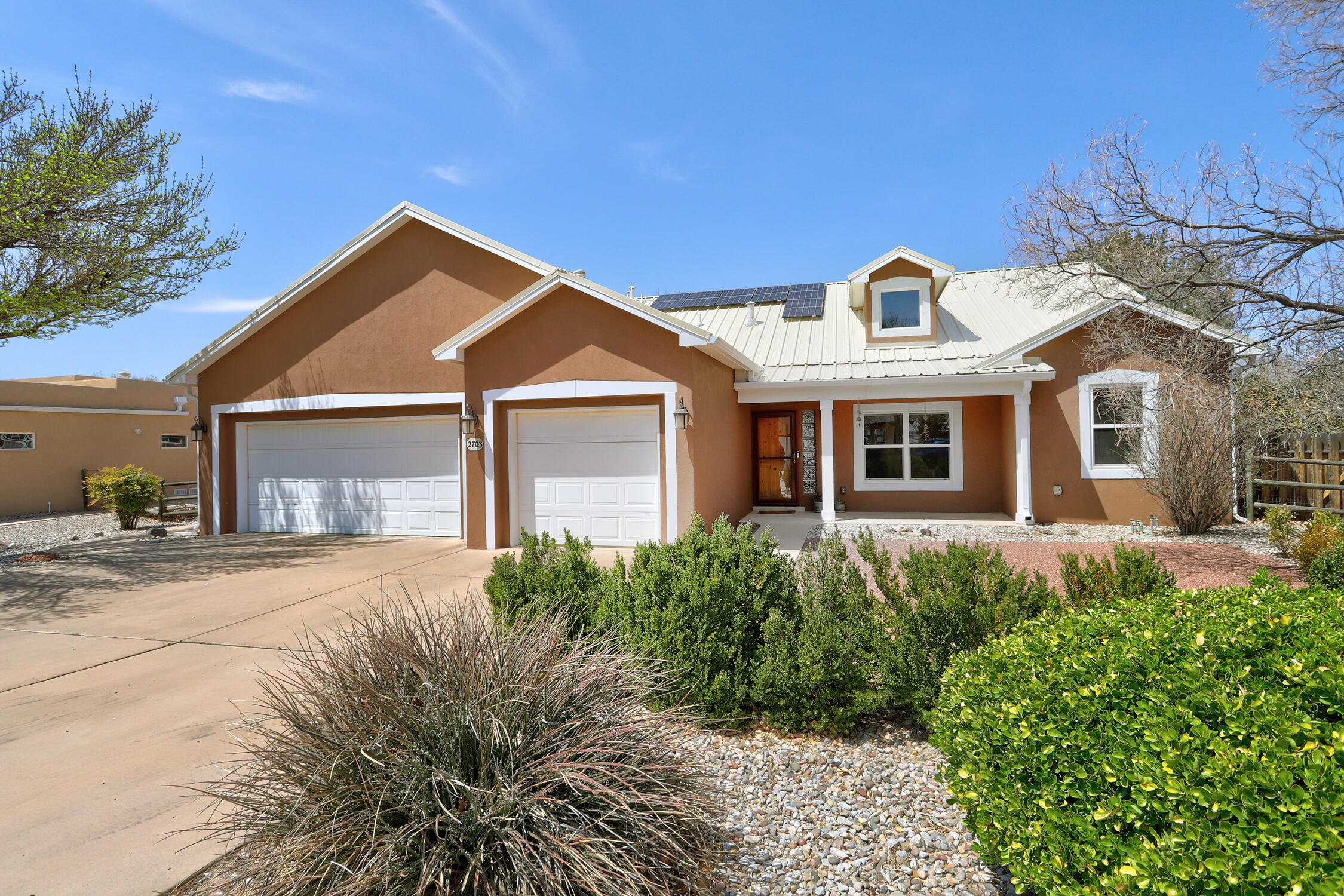 Gorgeous single story Northern NM style home nestled among the trees located in the popular Bosque del Rio neighborhood just steps from the Rio Grande. This 4 bedroom 2 1/2 bath home features a light, bright and open floor plan. Hard wood floors. Gourmet kitchen with island, granite countertops and pantry. Lovely primary suite with huge closet separated from secondary bedrooms. 3 car garage. Newer windows. Radiant heat. Refrigerated air. Newer stucco. Owned solar conveys. Beautiful yards. Corner lot. Convenient location close to hiking/biking trails, shopping and restaurants.
