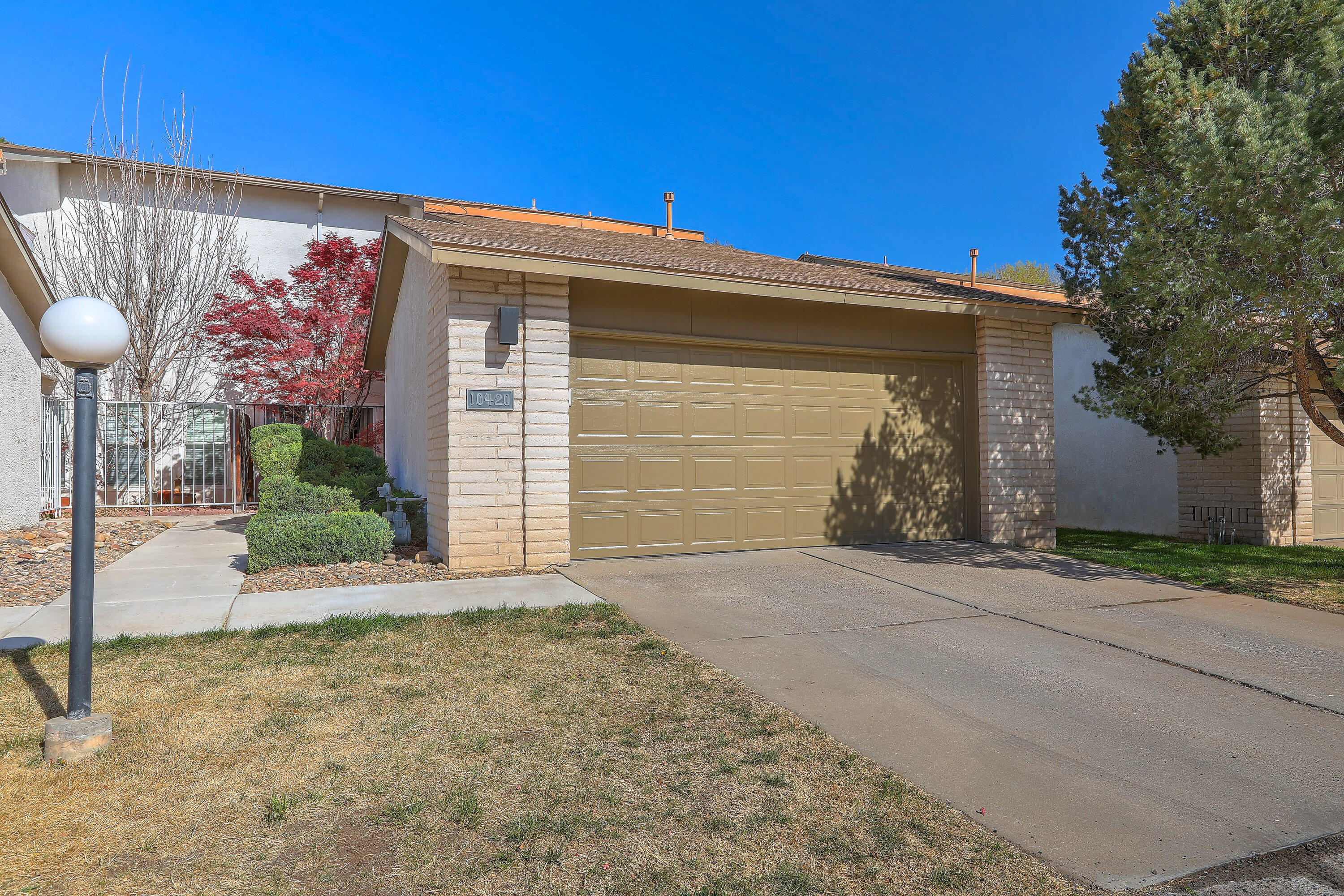 Charming two-bedroom home with stylish updates throughout, including remodeled bathrooms, newer windows, and upgraded flooring. Ideally located near CNM, popular restaurants, and shopping for ultimate convenience. Enjoy easy living with an HOA that covers water, trash, sewer, roof, landscaping, and community pool. The low-maintenance backyard offers a peaceful retreat--perfect for relaxing or entertaining with minimal upkeep.