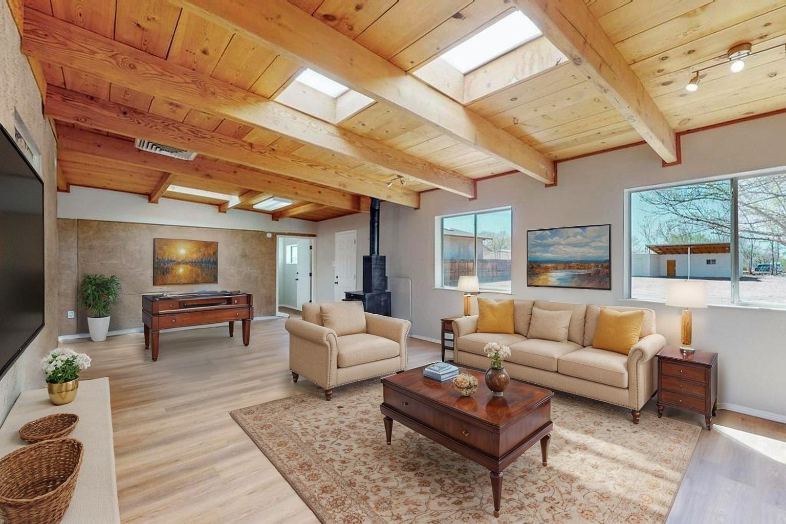 Welcome to this beautifully renovated 4-bedroom, 2-bathroom home nestled in the heart of the South Valley. Offering 2,554 SqFt of spacious living, this gem sits on a generous 0.44-acre lot with backyard access--perfect for all your toys or additional parking needs. Inside, you'll find a large family room, cozy wood-burning fireplace, and updated finishes throughout. The property features a private mother-in-law quarters, making it ideal for multi-family living. A detached garage/workshop adds even more functionality to this versatile home. Conveniently located near shopping, dining, and freeway access--this home truly has it all. Don't miss out on the charm, space, and opportunity this property offers!