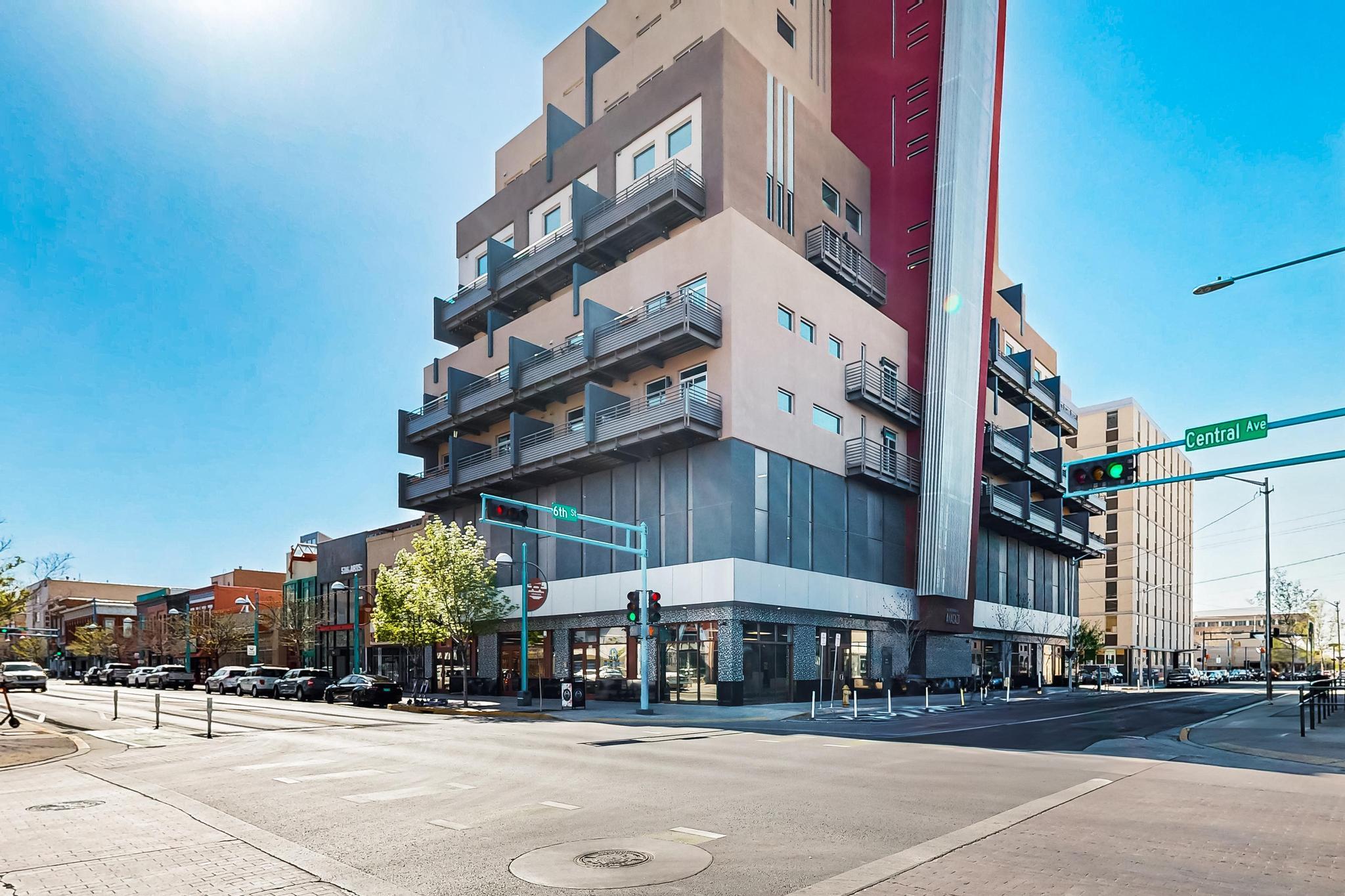 $2500 Seller Concession!! Heart of the city! Stylish executive loft, perfectly positioned at the corner of Central and 6th. Steps from the vibrant 505 Food Hall, a variety of dining options. Enjoy weekend strolls to the nearby park for the local farmers market--urban living has never been so convenient. This loft-style condo features soaring ceilings and expansive west-facing windows that flood the space with natural light. The open-concept design includes a generously sized kitchen--rare for this type of unit--plus both upstairs and downstairs living areas offering flexibility and comfort. Completed in 2015, the building is modern and well-maintained. If you're looking for a sleek downtown residence or a low-maintenance urban retreat, this loft delivers on location, style, and convenience.