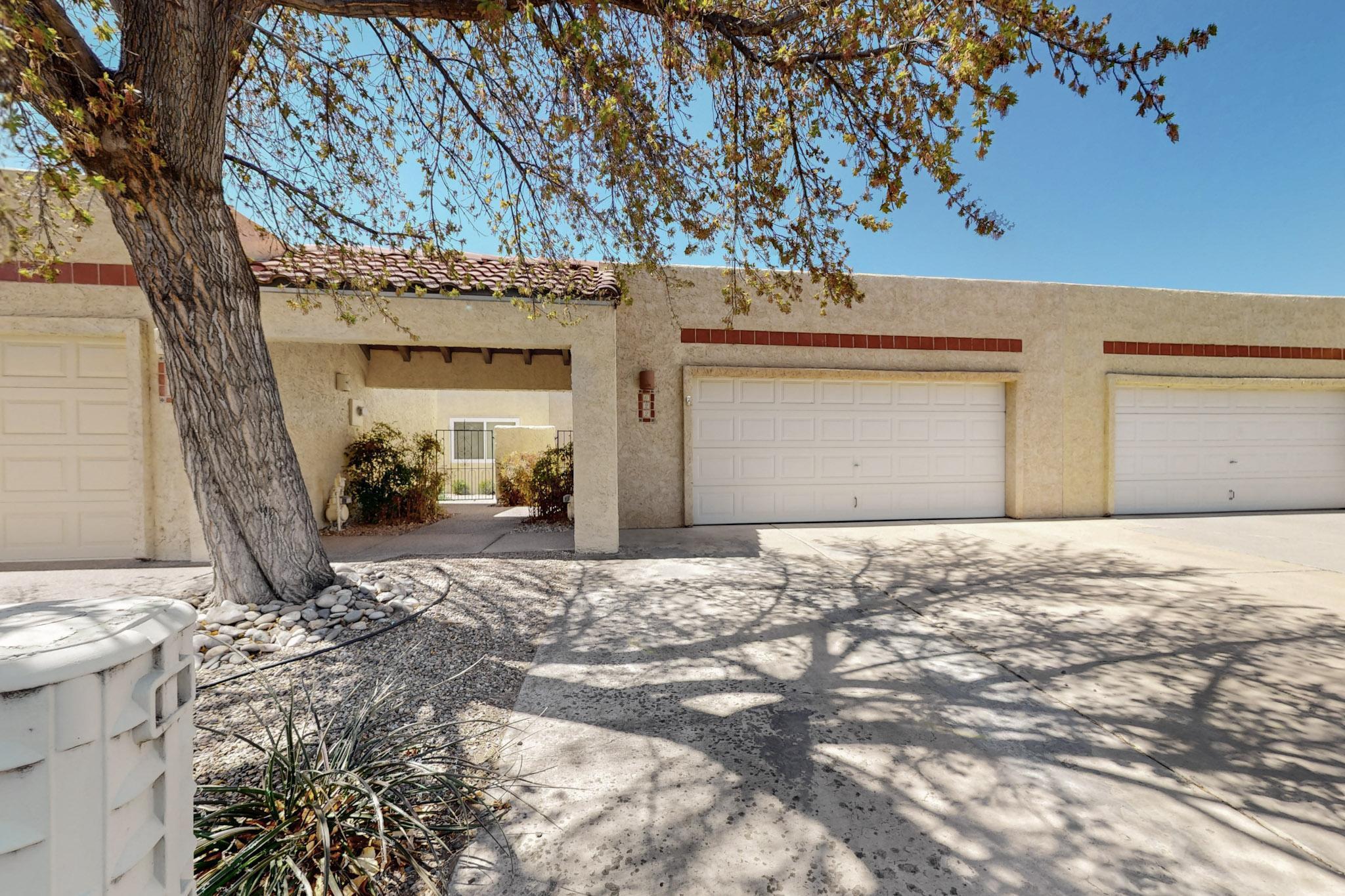 Charming Home in the 55+ Gated Community in The Islands! This MOVE IN READY One Story Home has 2 BR's 2 BA's, 2 CG, beautiful kitchen w/ breakfast nook, dining and living room w/KIVA FP w/ wall of Nichos and Raised Ceilings!! Wood Flooring w/Carpet in the BR's and Tile in the Baths/Laundry.  All appliances stay! Kitchen has nice tile counter tops and back splash! Primary BR has Two walk-in-closets and Full Bath w/Jetted tub! Owned Water Softener! Gated Courtyard and Covered back patio!  Garage is detached and just a few steps to the front door. HOA covers the water utility, common areas and streets!