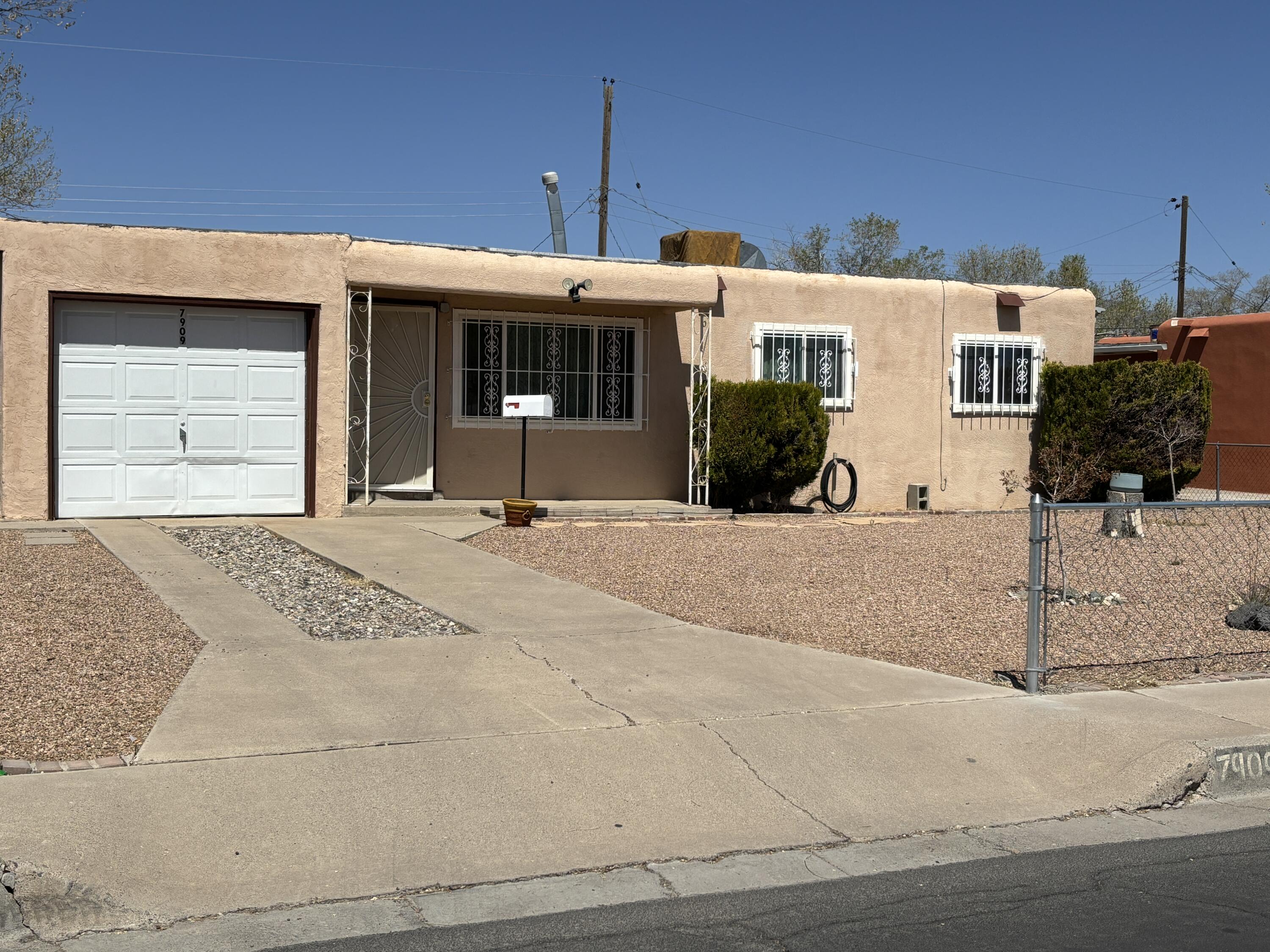 Excellent starter or investment home! New kitchen cabinets with soft closers and a quartz countertop, newer double-pane windows, decorative security bars, and ceiling fans. Carpet allowance available. Large yard for gardening or a play area!  Located in a convenient SE Heights location near Kirtland Air Force Base, Sandia Labs, ABQ Sunport, Hospitals, and more!