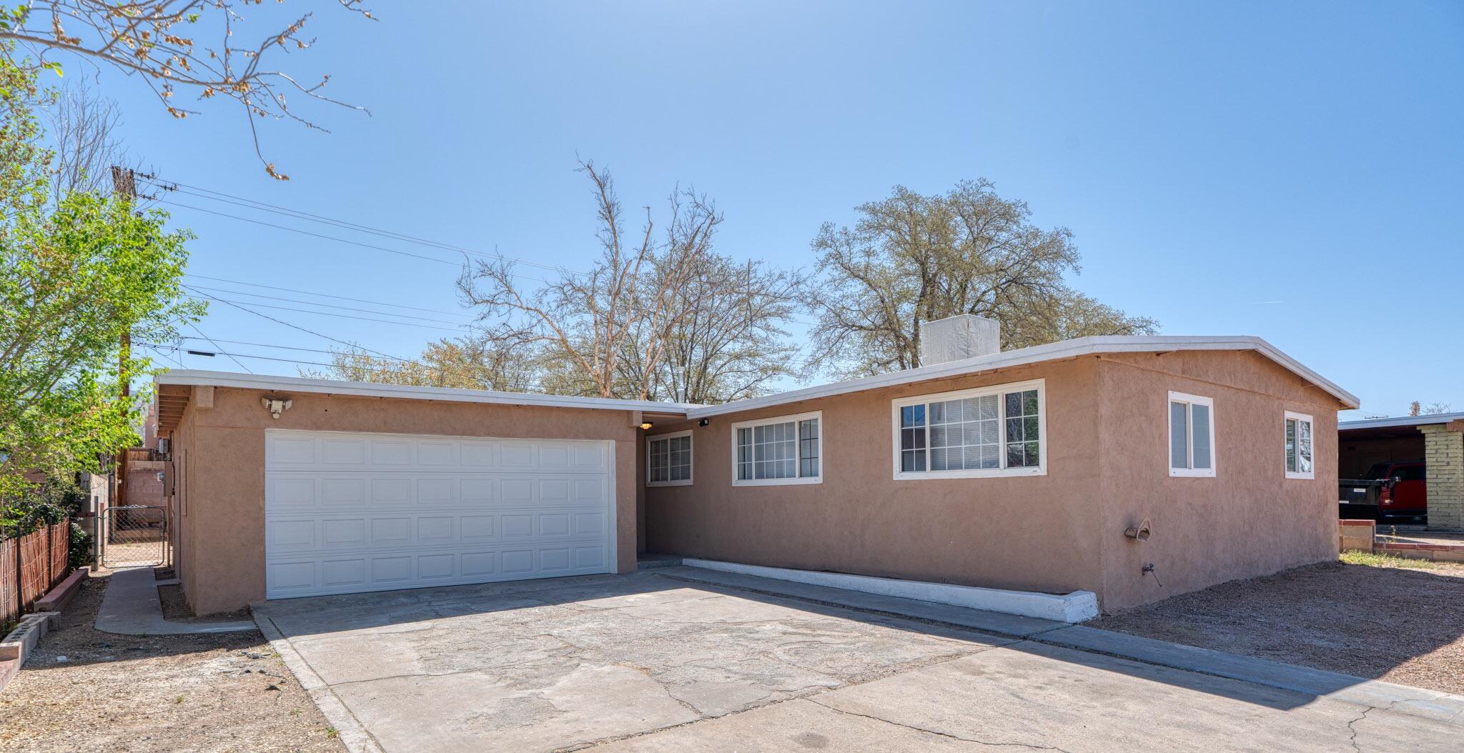 Come home to this elegant and peaceful retreat that boasts a bright open floor plan, 4 spacious bedrooms, granite countertops, ceramic tile throughout, and an oversized garage. Nestled in the heart of the desirable Northeast Heights, this home is the perfect blend of comfort and convenience- just minutes from shopping, schools, hiking trails and entertainment!  Immaculate and move in ready- don't miss out!