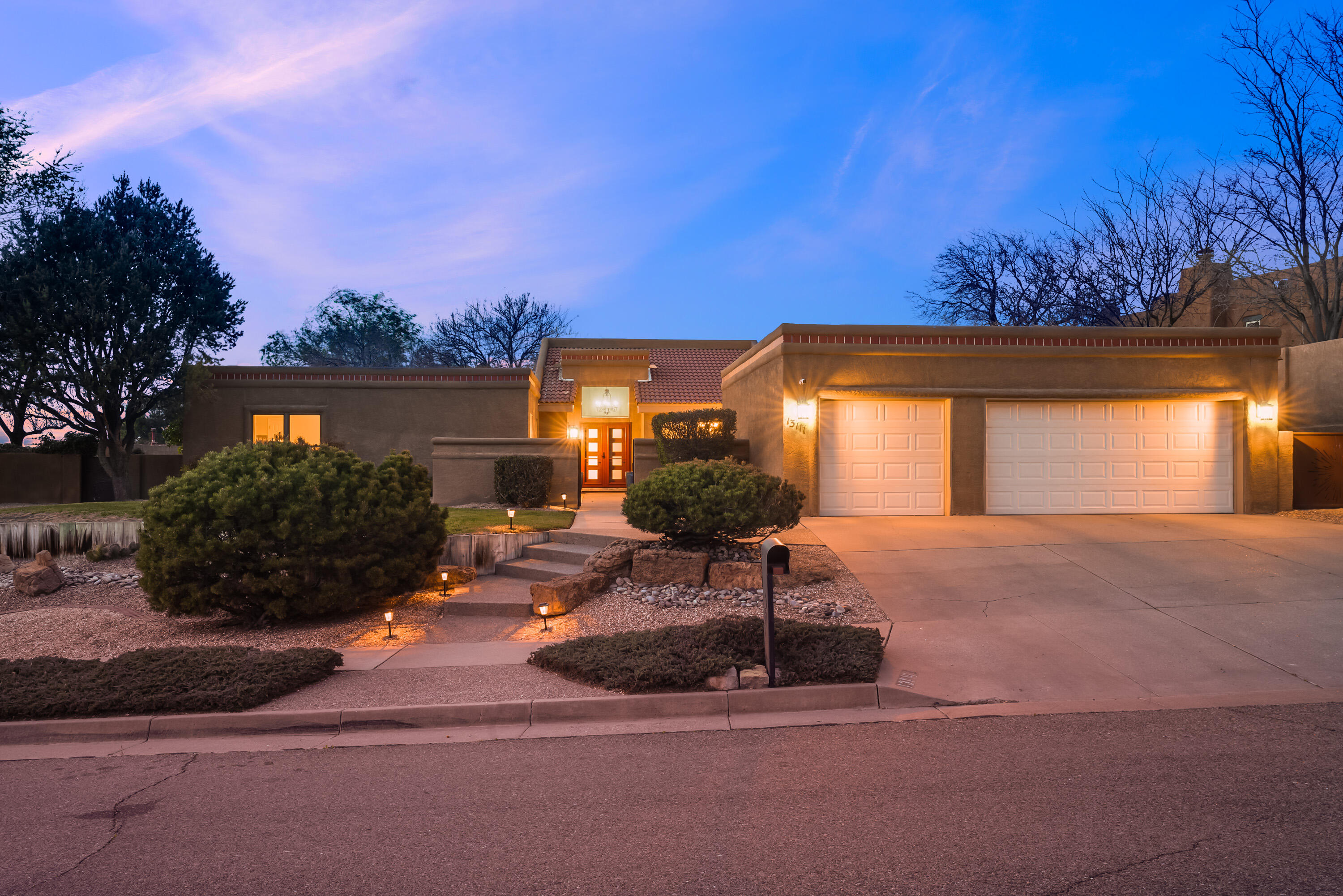 Sought-after NE location--just east of Tramway along the foothills! This single-level 4-bedroom home offers space and comfort on a 1/3-acre lot with a 3-car garage. Enjoy a large front courtyard with updated entry door and newer gate, plus a spacious backyard. Inside, you'll find two living areas, a functional kitchen with stainless steel appliances and granite counters. Owned solar system keeps electric bills low! Recently Maintained roof, parapets and newer skylights.  Other updates include newer HVAC, water heater, upgraded electric panel, newer dishwater and microwave. Convenient location to amenities, shopping, schools, and dining. Close to the Embudito trail for scenic hiking.