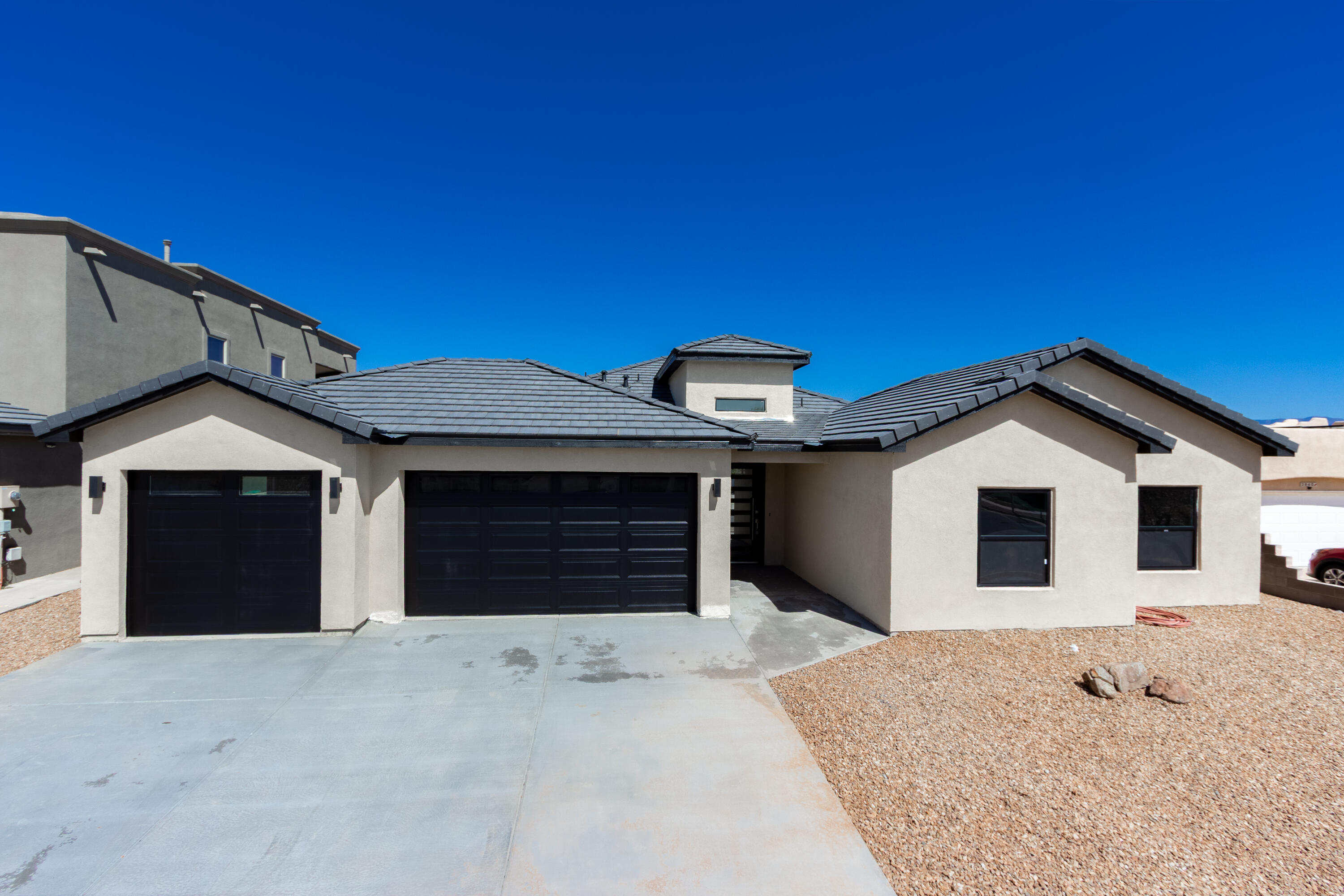 Brand NEW Home awaits you nestled in a highly sought area in the heart of Rio Rancho. This pristine home is conveniently located in the Estates of High Resort.  As you step inside, you're greeted by a foyer that sets the tone for the rest of the home, featuring an modern ring chandelier. Beautifully designed open concept floorplan, the fireplace has an inviting glow with advanced flame technology. Chef's Dream kitchen with New appliances and a large island with a waterfall granite countertop. Primary Bedroom has a generously sized spa like bathroom with stand alone tub. Separate stand up shower with built in bench. This home is ready for entertaining with large covered back patio ready to use while enjoying the Spectacular VIEWS of the Sandia Mountains. Xeriscape landscape design!