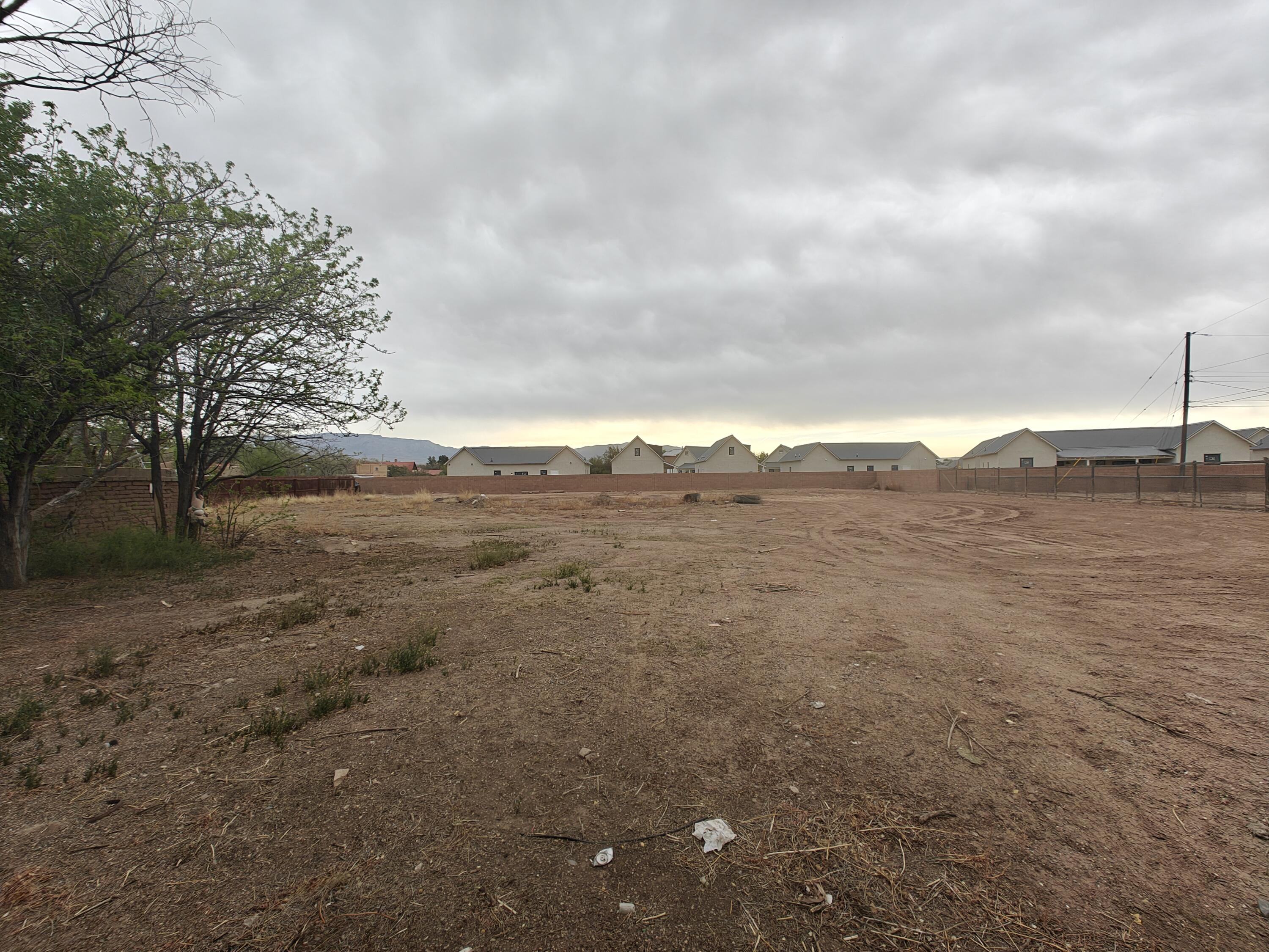Located on a quiet private road in one of ABQ's most sought-after neighborhoods, 1920 San Martin NW is a over 0.25-acre residential lot ready for your vision. Surrounded by lush vegetation and peaceful acequias, this flat, buildable lot is tucked just off Rio Grande and Griegos--ideal for custom living. With utilities nearby and limited traffic, enjoy serenity without sacrificing access to shops, dining, I-40, and the Bosque. Secure this slice of the North Valley for and create something special in a truly cherished location. Being sold as a package for over 1/2 acre for $300,000. Other address is 1918 San Martin Place NW ABQ, NM 87107.