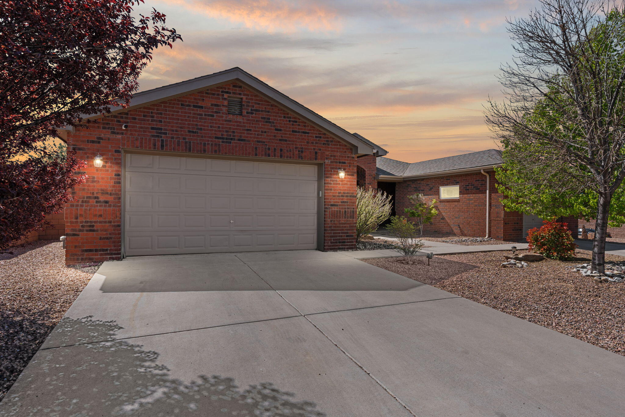 Beautiful corner-lot home in the highly sought-after, gated Cabazon community in Rio Rancho, featuring stunning curb appeal, a brick exterior, and leased solar! Inside, you'll find two spacious living areas, a home office space, a cozy fireplace, recessed lighting, ceiling fans, and refrigerated air for year-round comfort. The kitchen boasts island seating, built-in appliances, and a tile backsplash. Tile and laminate flooring flow throughout, adding modern charm. The primary suite includes a walk-in closet, double vanity, jetted tub, and separate shower. The laundry room offers a sink for added convenience. Featuring a 3-car garage, walled backyard, and landscaped front and back, this home is the perfect blend of luxury and comfort--make it yours today!