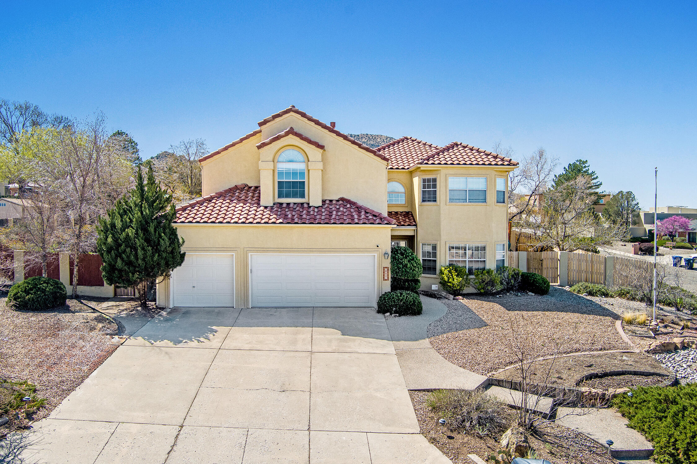 Perched on a spacious corner lot in desirable Four Hills Village, this beautiful 4-bedroom, 2.5-bath home is move-in ready and offers stunning views! Tall ceilings, natural light, and vinyl & tile flooring highlight the bright, open layout. The gourmet kitchen features granite countertops, stainless steel appliances, and double ovens. The large primary suite offers high ceilings, lovely views, and a luxurious bath with double sinks, a soaking tub, and a separate shower. Step into the serene backyard oasis with lush grass, raised garden beds, and mature trees and plants. A 3-car garage provides ample storage. Just minutes from KAFB and shopping. Enjoy golf, swimming, pickleball, and tennis at the Canyon Club, plus open space with hiking and biking trails--all within the neighborhood.