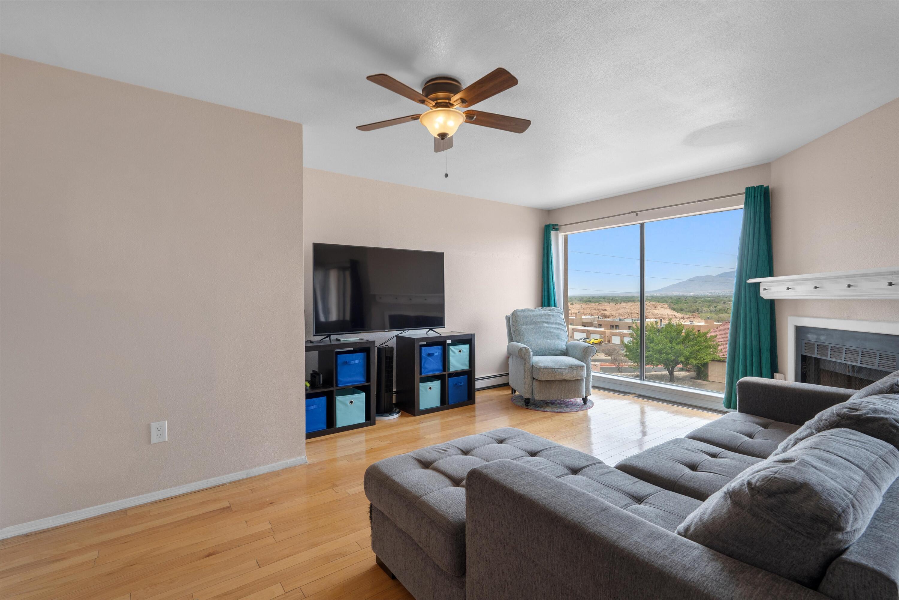 Welcome to this beautiful townhome in the gated Westcliffe community.  Breathtaking views of the river valley and the Sandias.  The home features a large kitchen with granite counters, and ample storage. While dining or relaxing in the living room, take in the amazing views and city lights without even getting up.  Bedrooms are on the lower level for convenience. The primary suite features a large vanity with 2 sinks and 2 walk-in closets. The shower has been updated as well with a modern touch. Beautiful new stucco is 1 year old. New TPO roof to be installed prior to closing with warranty for new owner. Come see this fabulous home today.