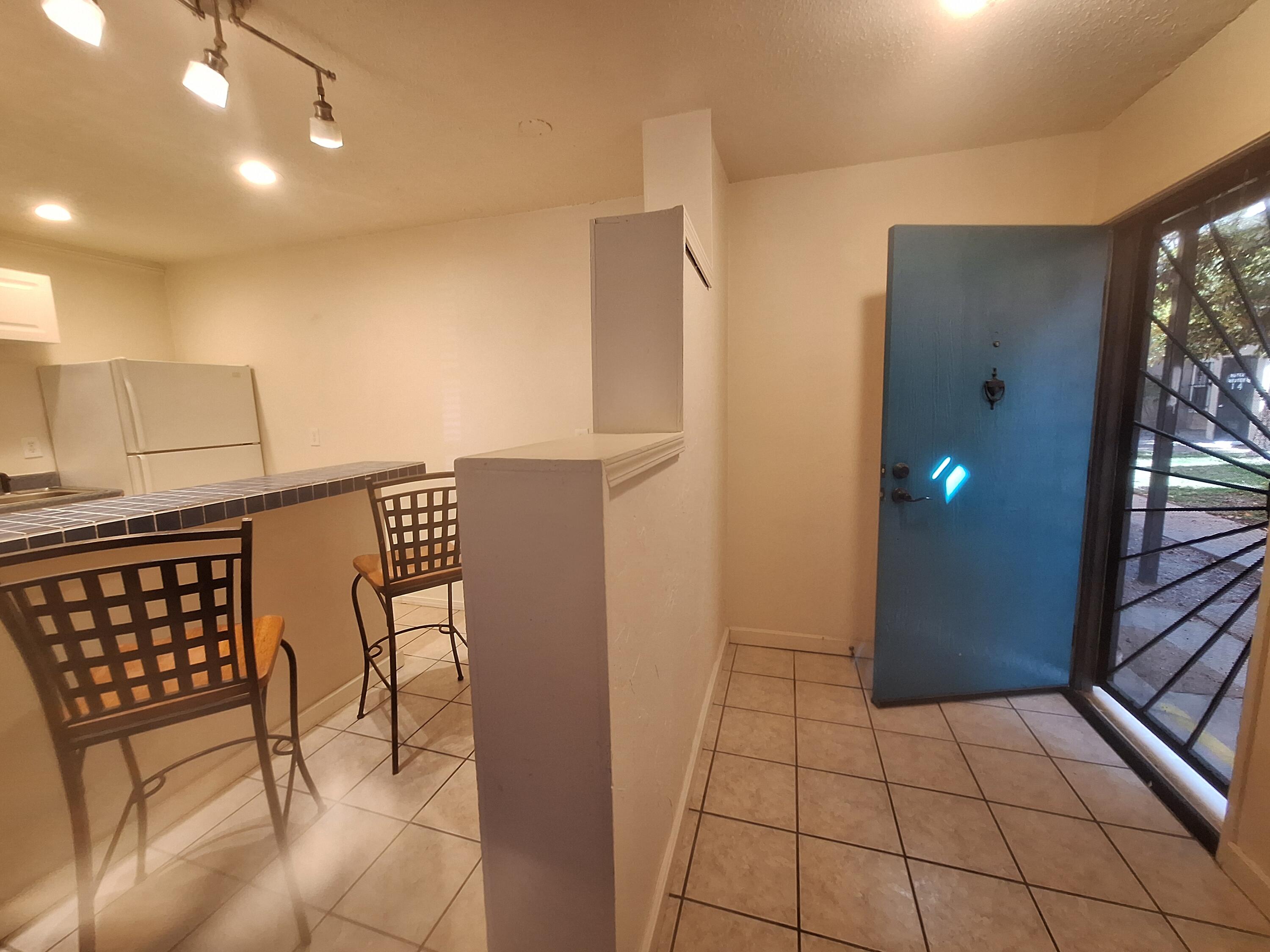 BEAUTIFUL RENOVATED CONDO IN A GATED COMMUNITY.  This unit has been completely remodeled with glass blocks in bathroom for extra lighting  & ambiance, updated electric panel, tile & carpet throughout, tiled breakfast niche, bookcase, large walk in closet, washer & dryer.  The unit has an open living area with natural light, perfect for low maintenance living & a very affordable way to own your own home. Beautiful courtyards, community pool &  laundry room, pet areas, parking and  security.  Located near NOB Hill, Kirtland AFB, ABQ Sunport, UNM, CNM, Isotopes Park, Lobo Stadium, various eateries, entertainment venues & is next to a golf course. Grounds feature lots of foliage & Ponderosa pine trees nestled among the condos with lots of shade.  COA covers utilities and ground maintenance.