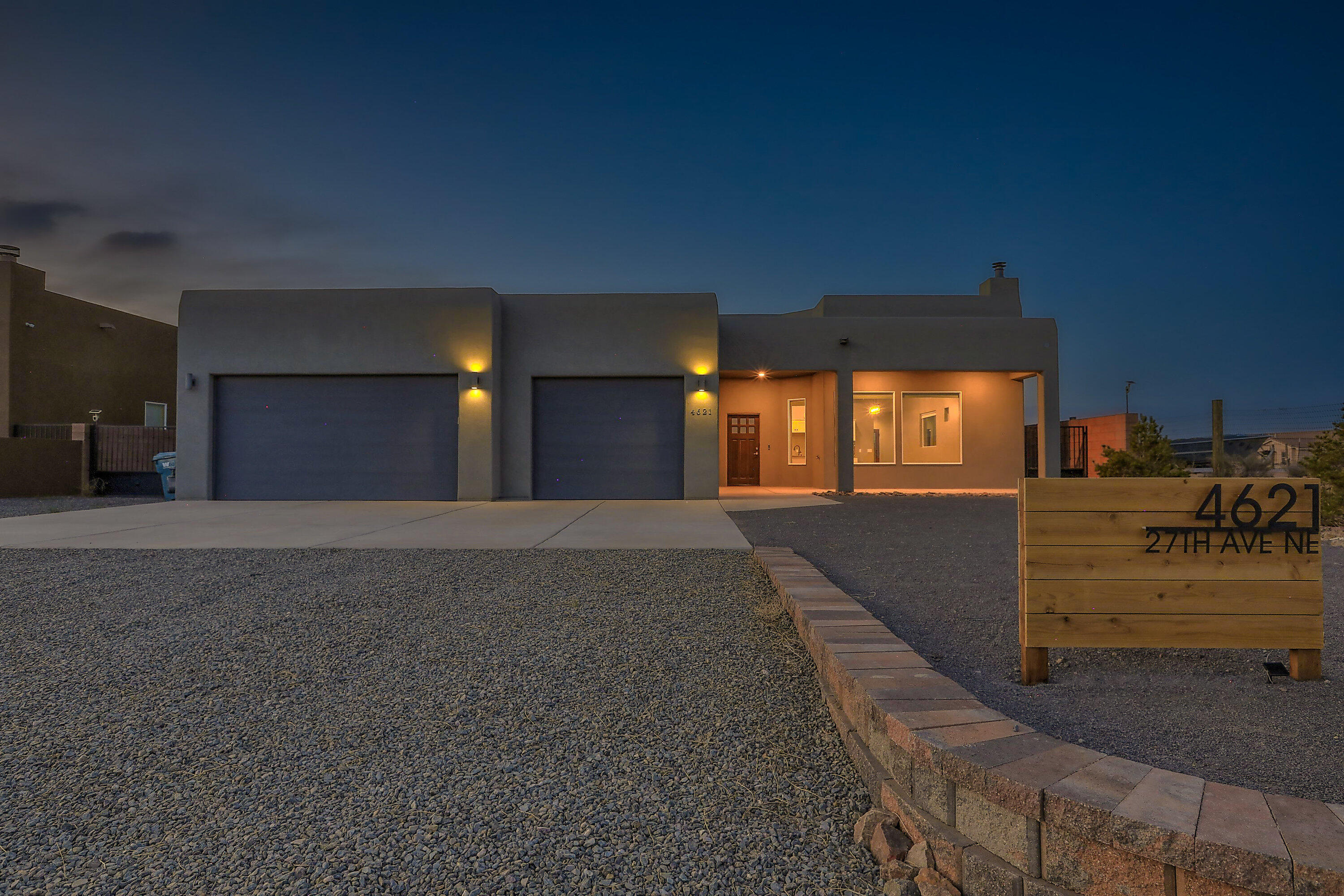 Welcome to your modern retreat on a peaceful half-acre in Rio Rancho! This custom 4-bedroom, 3.5-bath home is packed with luxury touches and built for everyday comfort and entertaining. From the moment youwalk into the spacious great room, you're greeted with 12-foot ceilings, a stunning stone fireplace, and panoramic mountain views.The chef's kitchen will impress with its oversized island, upgraded black stainless appliances, farmhouse sink, custom backsplash, and generous walk-in pantry. You'll also love the soft-close hardwood cabinetry andbuilt-in wood shelving for added function and elegance. Ambient LED lighting adds a warm nighttime glow to the main living space.The open layout flows perfectly into the dining and living areas, while a separate flex space makes an ideal...
