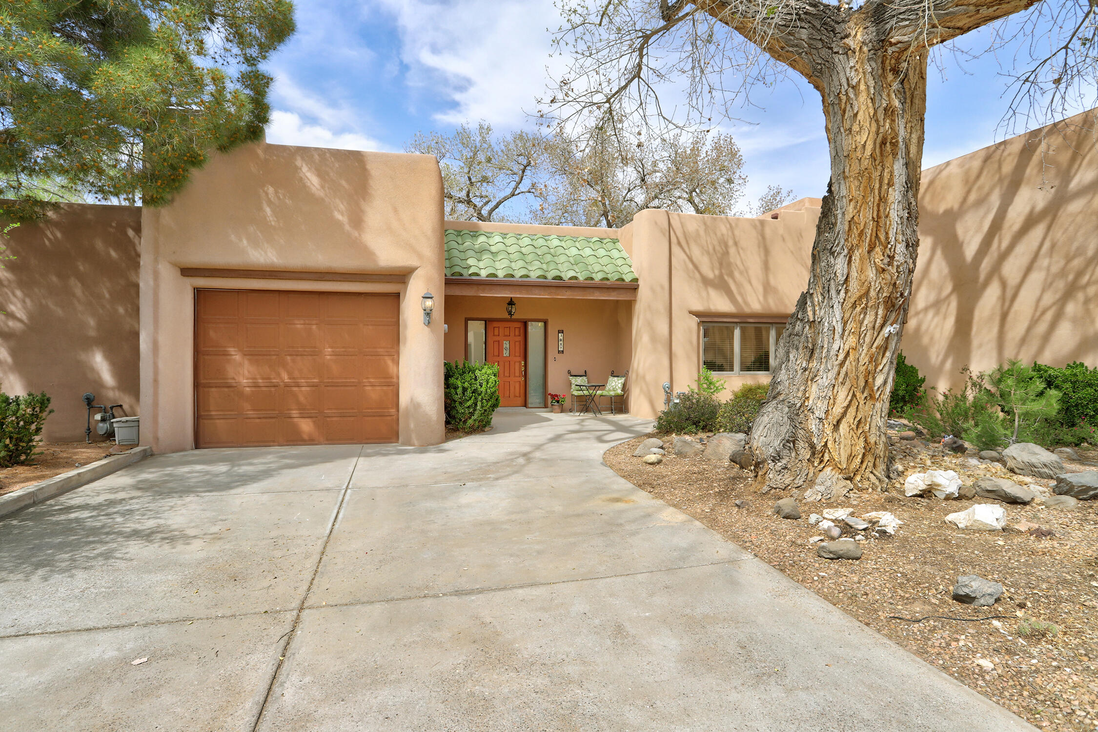 A Rare Offering in the Gated Rio Grande Compound! Step into this thoughtfully designed custom single-story home and be instantly drawn to the green canopy of the Candelaria Nature Preserve, unfolding just beyond the back patio. Here, the everyday feels extraordinary, where graceful sandhill cranes glide by and hot air balloons rise with the morning light. Nestled at the end of scenic Campbell Road, this coveted gated enclave sits at the gateway to the Bosque River Trail, offering seamless access to 17 miles of picturesque, groomed paths along the Rio Grande. Designed with comfort and ease in mind, this open-concept home features radiant-heated tile floors, rich wood accents, and abundant natural light throughout. The floorplan includes two spacious and private primary (More)...