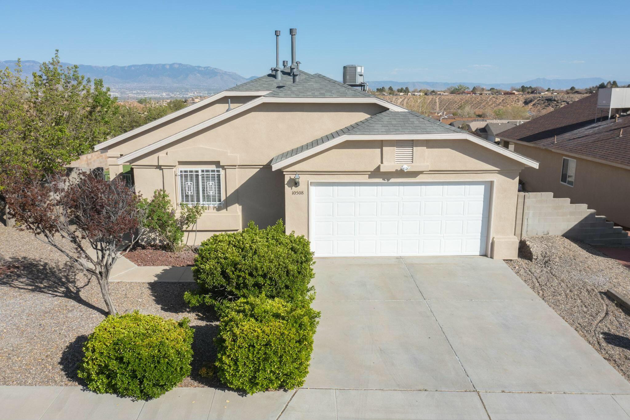 Corner Lot Charm!Well-maintained single story 3BD/2BA home on a desirable corner lot w/ unobstructed mountain views!Bright living area features vaulted ceiling,easy-care flooring (no carpet)& gas log fireplace.Primary suite includes its own private bathroom w/ soaking tub,sep.  shower,large walk-in closet,plus a sliding glass door to the backyard,while 2 additional bedrooms provide plenty of space for family,guests,or a home office.Both bathrooms offer dual sinks.Roof replaced in 2023 & comes with a transferable warranty.The home was converted to refrigerated air at the same time.Outdoor features include a covered patio and low-maintenance yard--perfect for relaxing or playing.Security doors and window bars add peace of mind.Located near parks,shopping,& schools--this home is move-in ready!