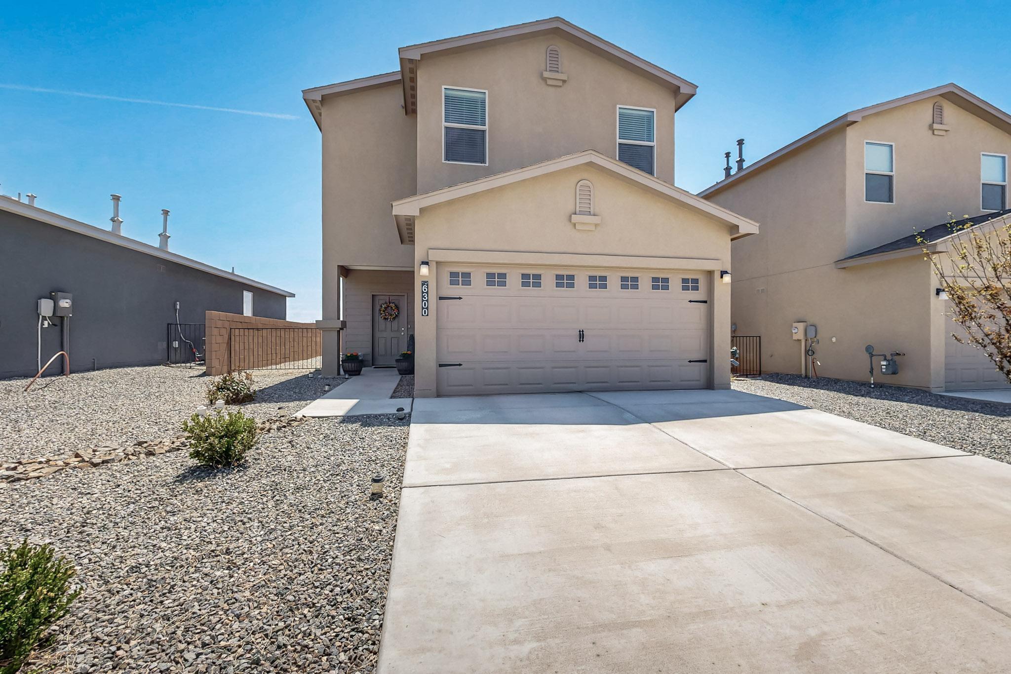 $5000 CREDIT FOR BUYER CLOSING COSTS! Gorgeous 2023 Twilight Home located in the Mountain Hawk community of Rio Rancho! This spacious home boasts 4 bedrooms and 3 bathrooms, offering plenty of room for the whole family. The open floor plan, enhanced by 9' ceilings, creates a welcoming atmosphere! The large kitchen with its huge island, SS appliances, and a pantry, is ideal for family dinners. The dining room leads out to a covered patio with a huge fully landscaped backyard, perfect for enjoying those sunny days. The large primary bedroom includes a walk-in closet and an ensuite with double vanity sinks and a walk-in shower. You'll appreciate the convenience of the upstairs laundry room and refrigerated air for hot summer days! This home is a must-see!