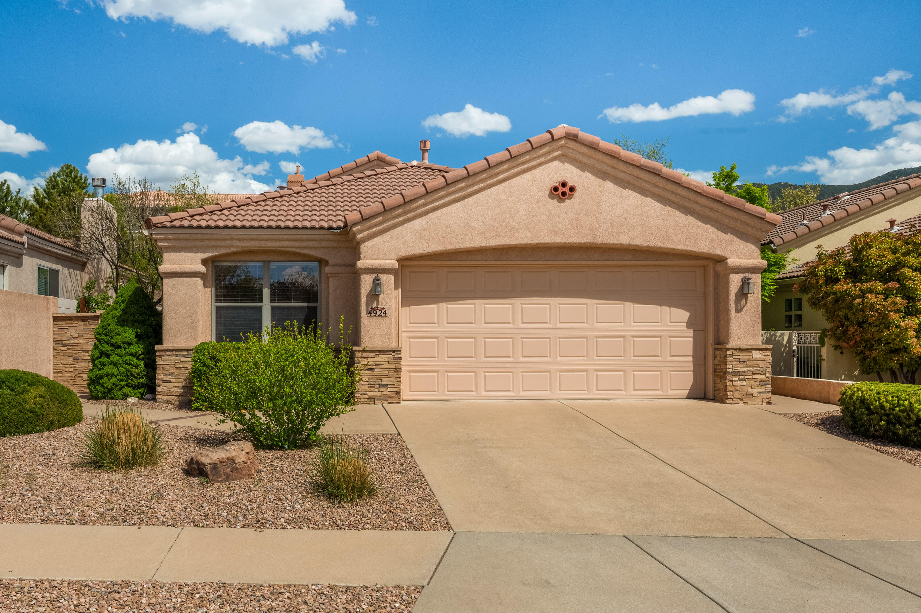 Welcome to this well kept, single-owner patio home in an established community. Built by Mechenbier in 1998, this 3 bedroom, 2 full bathroom home is centrally located on a private cul-de-sac and minutes away from the foothills and plenty of amenities. The light filled kitchen offers custom touches like granite countertops, an extra wall of cabinetry not offered on all homes in this community and even a glass rinser. Your primary retreat is spacious with a large walk in closet. Enjoy a backyard sanctuary that offers an upstairs viewing deck, covered patio and beautiful xeriscaping all on a drip system for easy maintenance. Don't miss out on this NE Heights gem!