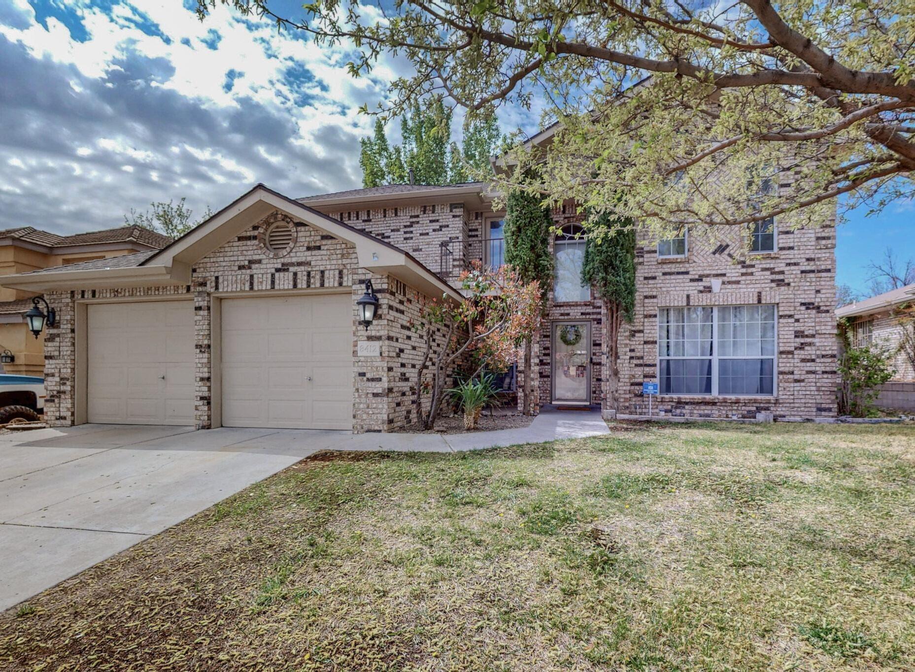 Prime Location! Just a half block from trail access to the Petroglyph National Monument! Oppel Jenkins brick beauty!  Wonderfully maintained and thoughtfully updated home. This spacious 4-5 bedroom home sits on a large, fully landscaped lot with possible backyard access. You'll find fresh paint, updated lighting, new carpet, a pellet stove, abundant natural light, spacious bedrooms, and a generous laundry area w/laundry chute. The kitchen features new granite countertops & updated flooring. The owner's suite offers vaulted ceilings, one of two balconies, & laminate wood floors. The en-suite offers a separate shower & garden tub with access to the enormous walk-in closet. Enjoy the comfort of refrigerated air with a new condenser installed in 2023. Roof replaced in 2016 & serviced.