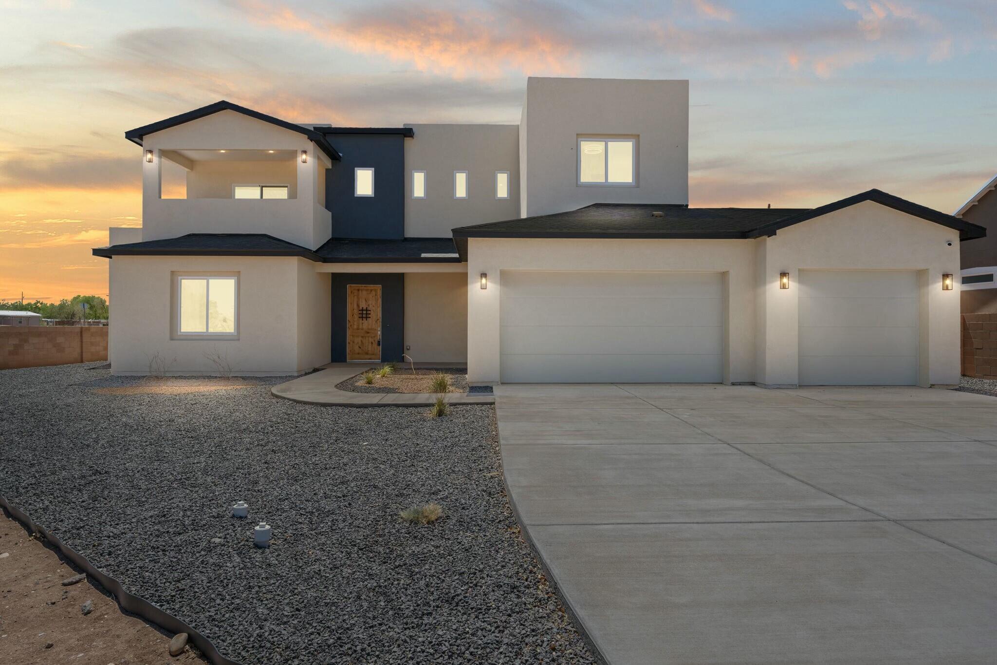 This stunning brand-new home combines modern luxury with everyday comfort. Located in a secure gated community in the North Valley, it offers peace of mind and a vibrant neighborhood feel--an ideal setting for raising a family. High ceilings create an airy, open atmosphere throughout. The spacious main-level primary suite provides convenience and privacy, while multiple living and dining areas make this home perfect for entertaining. Enjoy the flexibility of a 3-car garage--ideal for vehicles, storage, or a workshop setup.